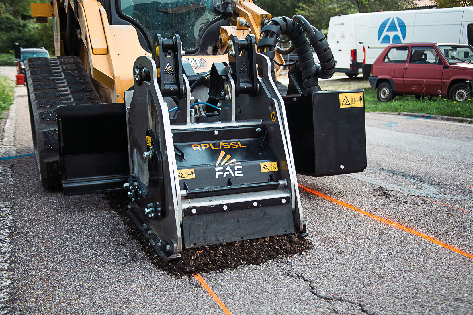 FAE’s RPL/SSL Road Planer in action, attached to a skid steer.