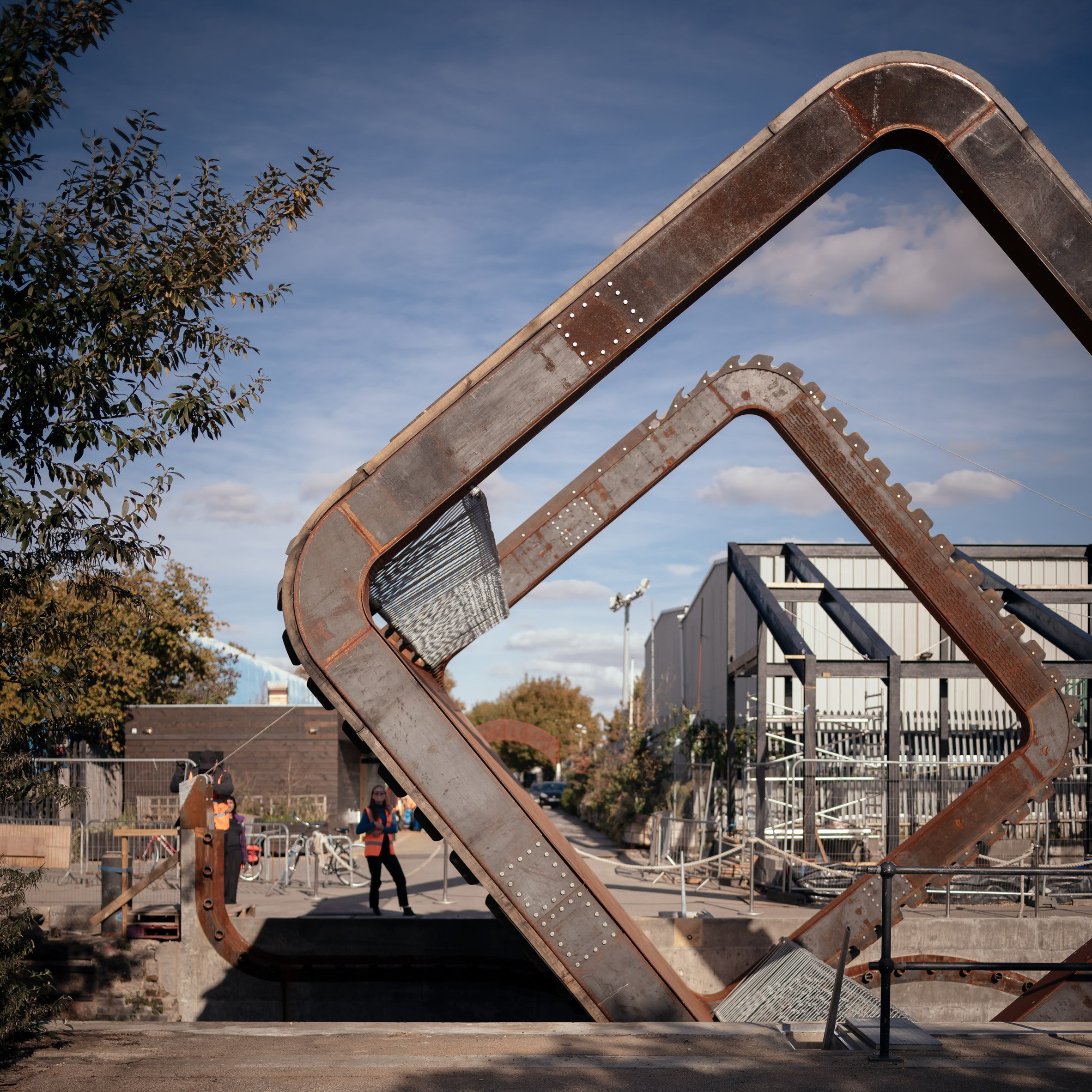 Rolling bridge in London with steel siding