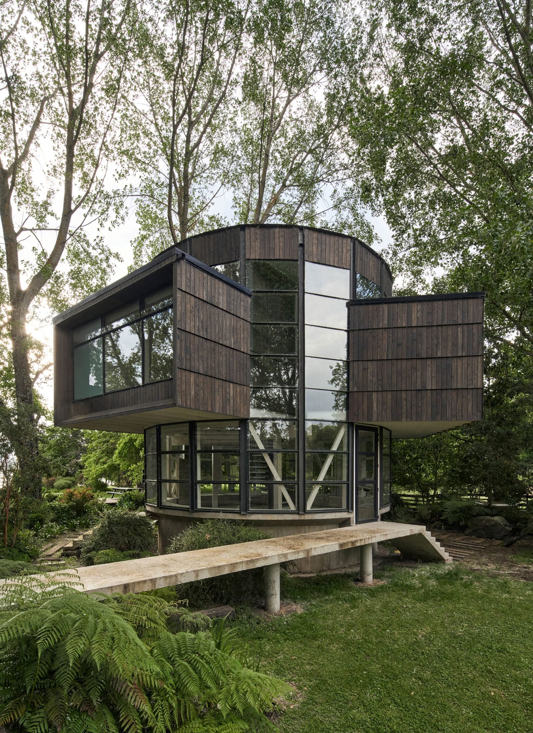 Pine-clad house with cantilevering rectilinear features in Chile