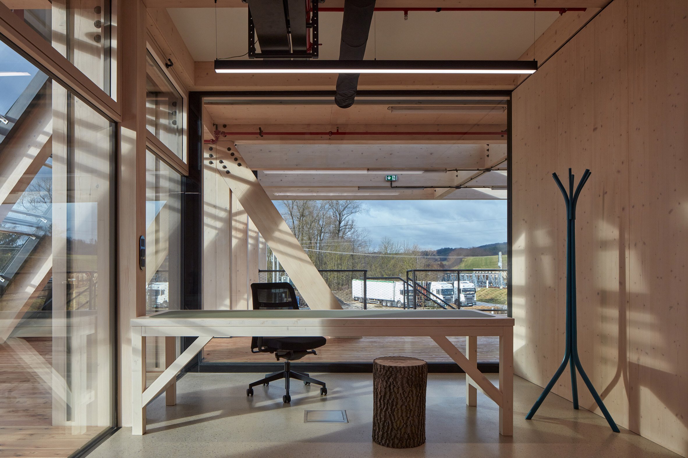 Wooden workspaces in Kloboucká lesní headquarters
