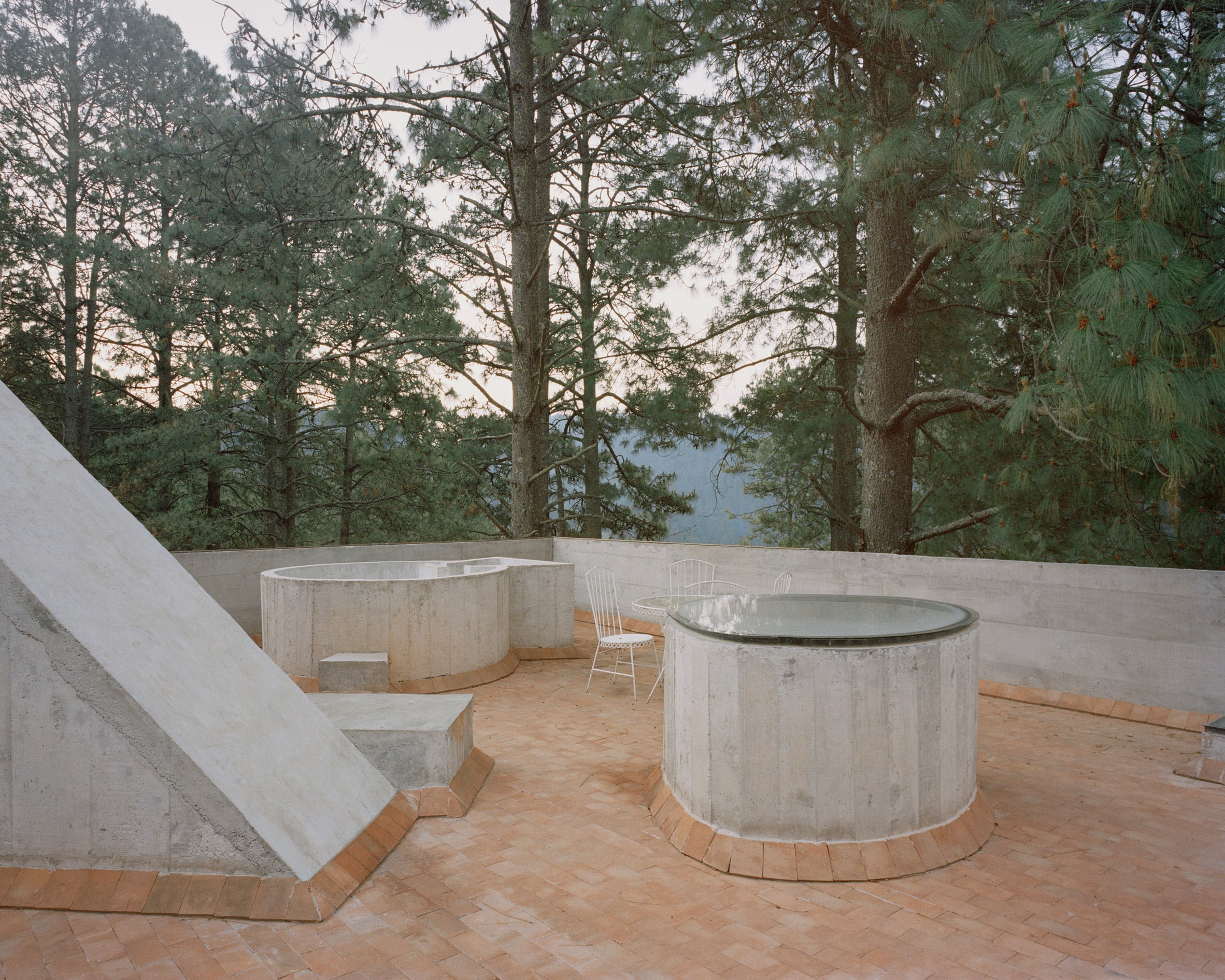 Geometric shaped concrete built-in furniture on rooftop terrace of Mexican holiday home