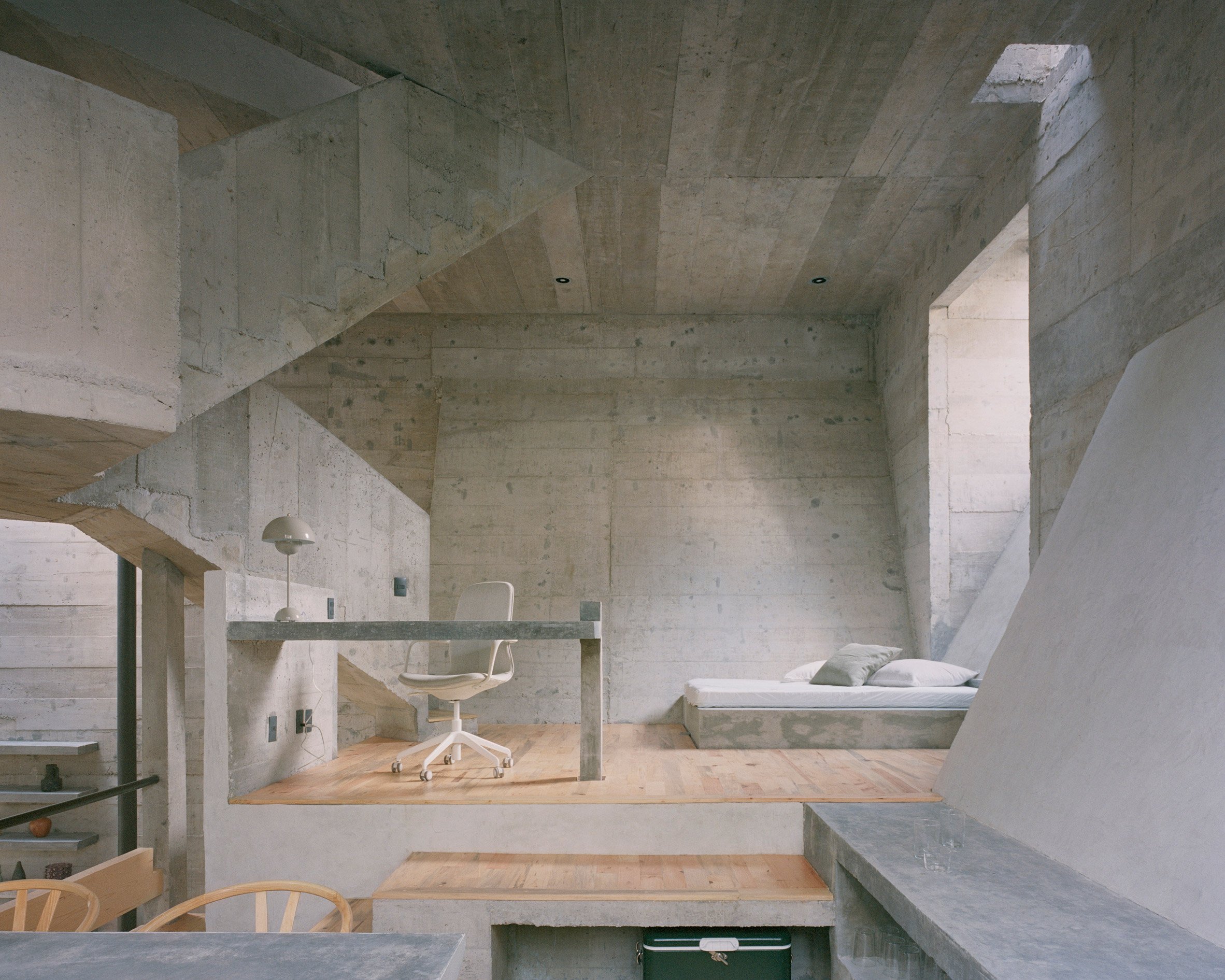 Mezzanine-style bedroom within open-plan holiday home