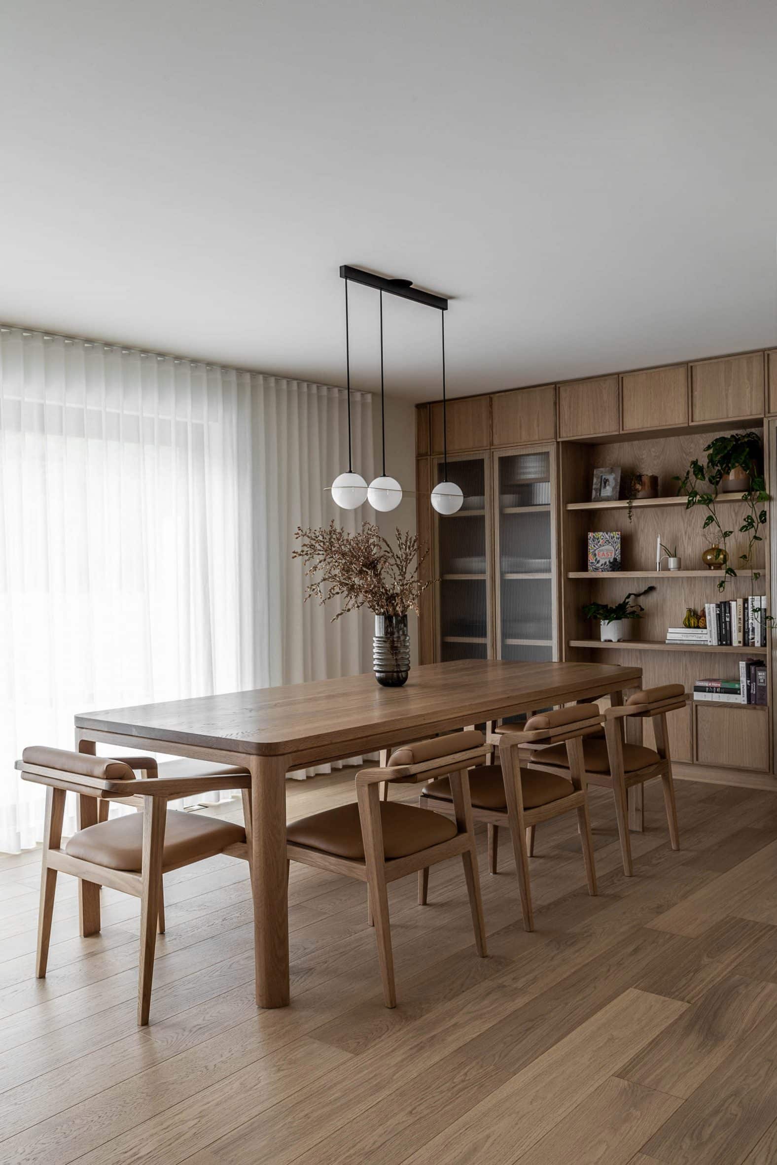 Wood-lined dining room within interior of Quebec house, Montreal