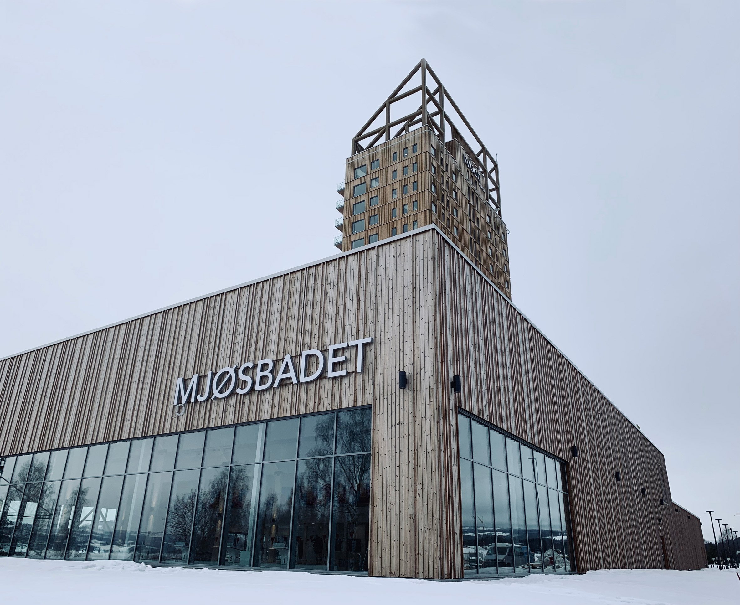 The exterior of a timber building in snow