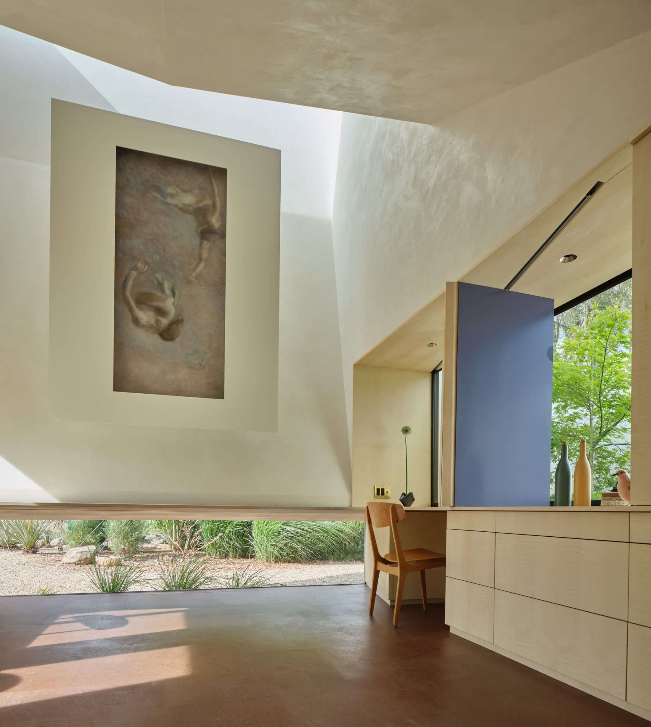 Light-filled home studio with angled skylight roof
