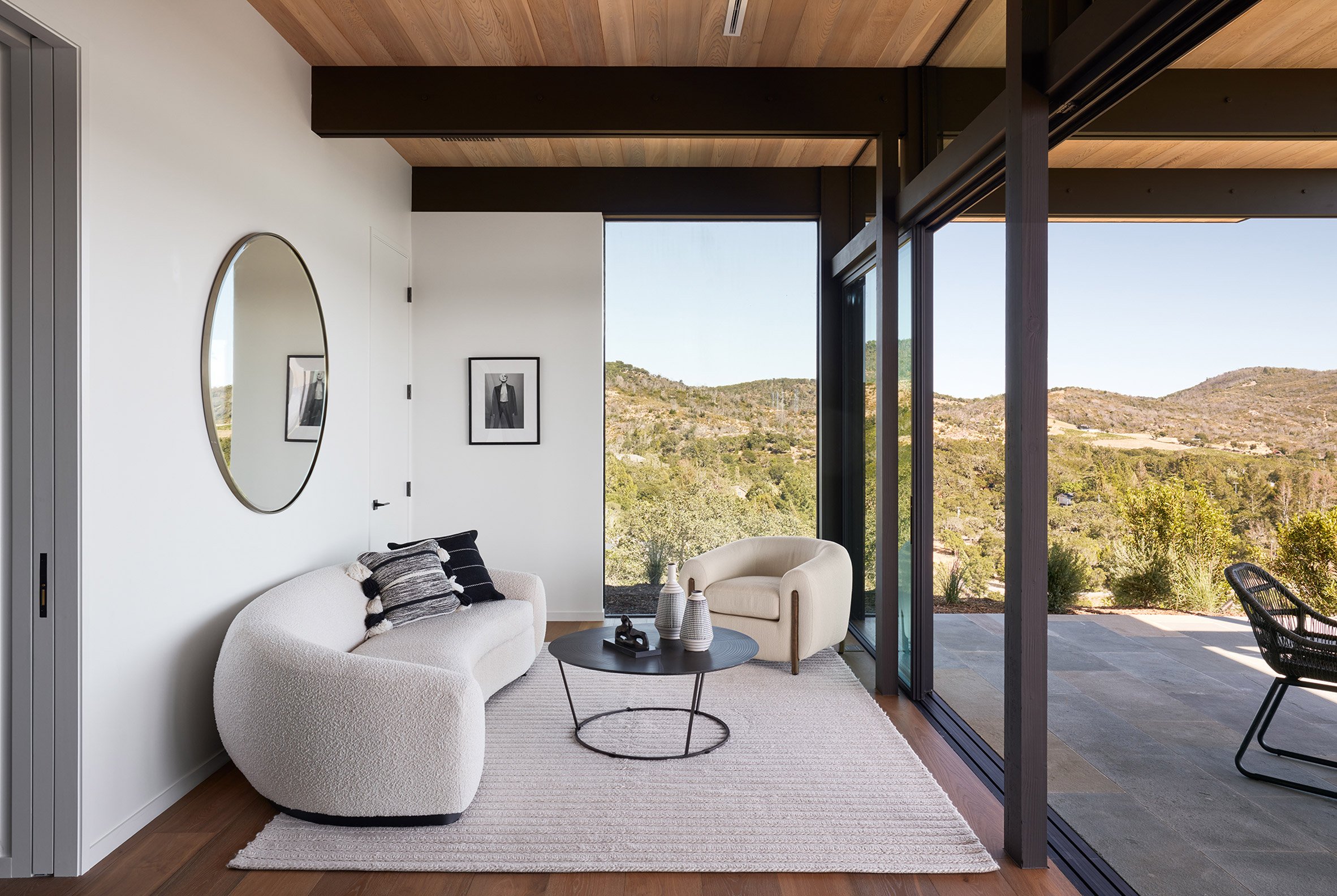 Interior living space that connects to outdoor patio with sliding glass doors