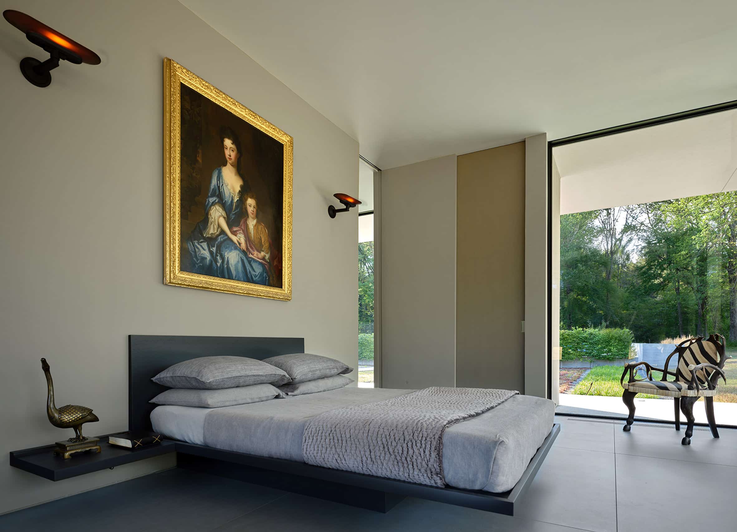 Bedroom suite with historical artwork hanging over the double bed