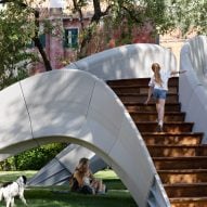 Girl climbing up stairs of Striatus 3D-printed concrete footbridge