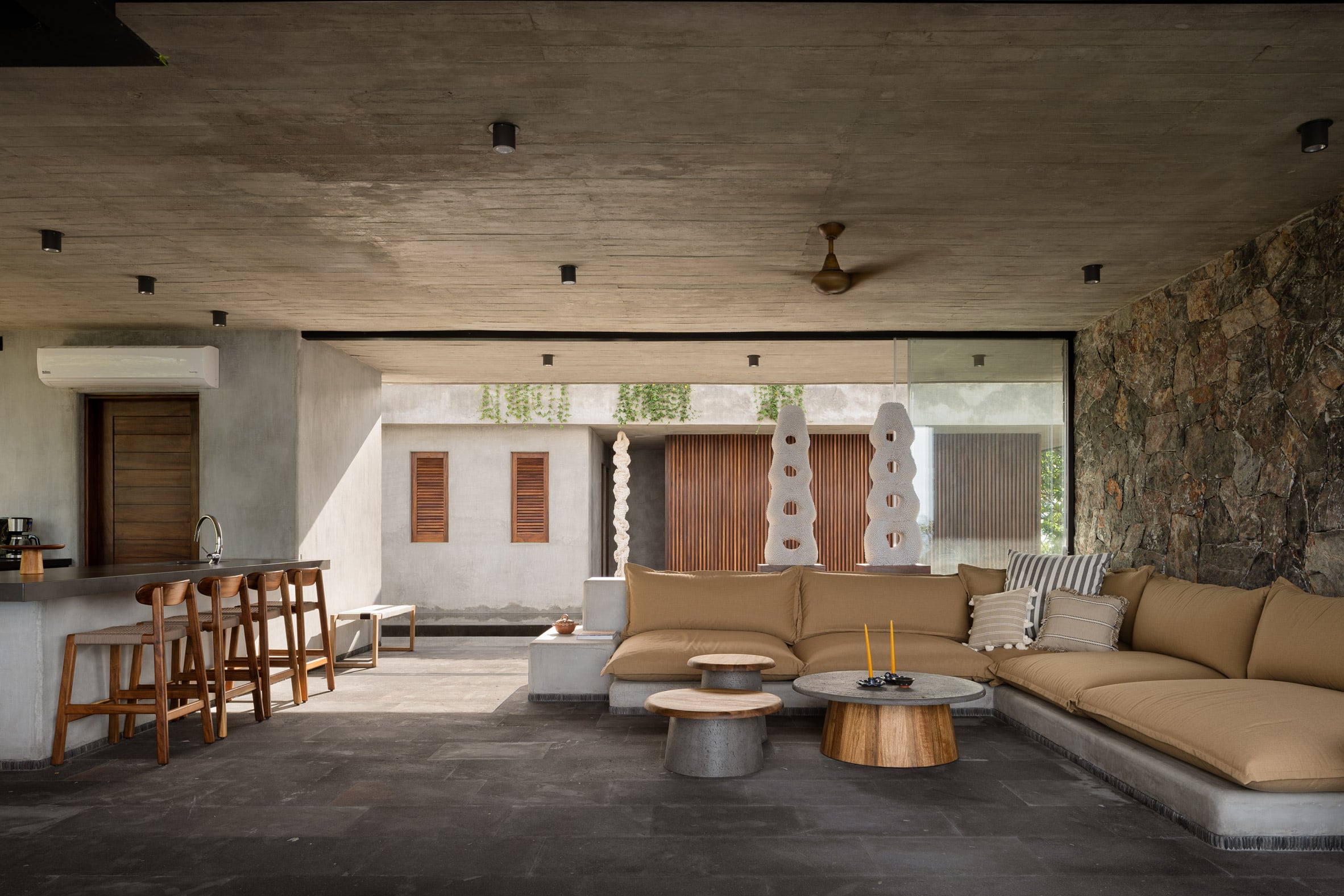 White deep sea coral sculptures next to the neutral living room at Casa Mateo by Zozaya Arquitectos