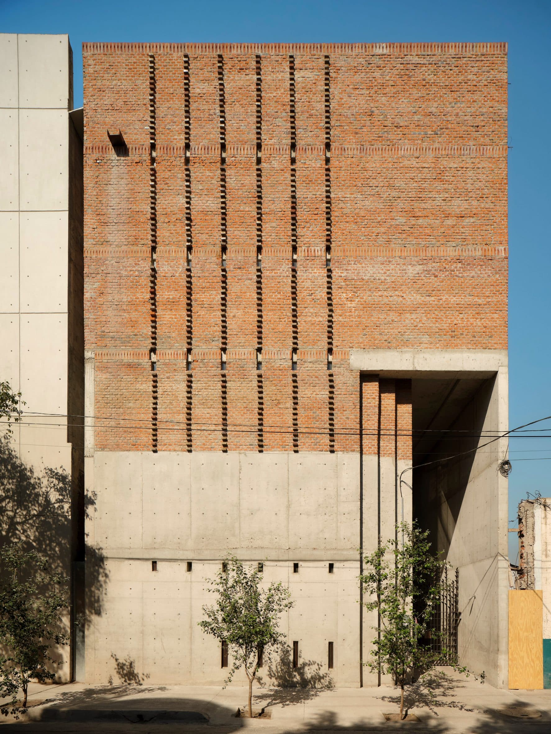 Brick and concrete building with tall doorway