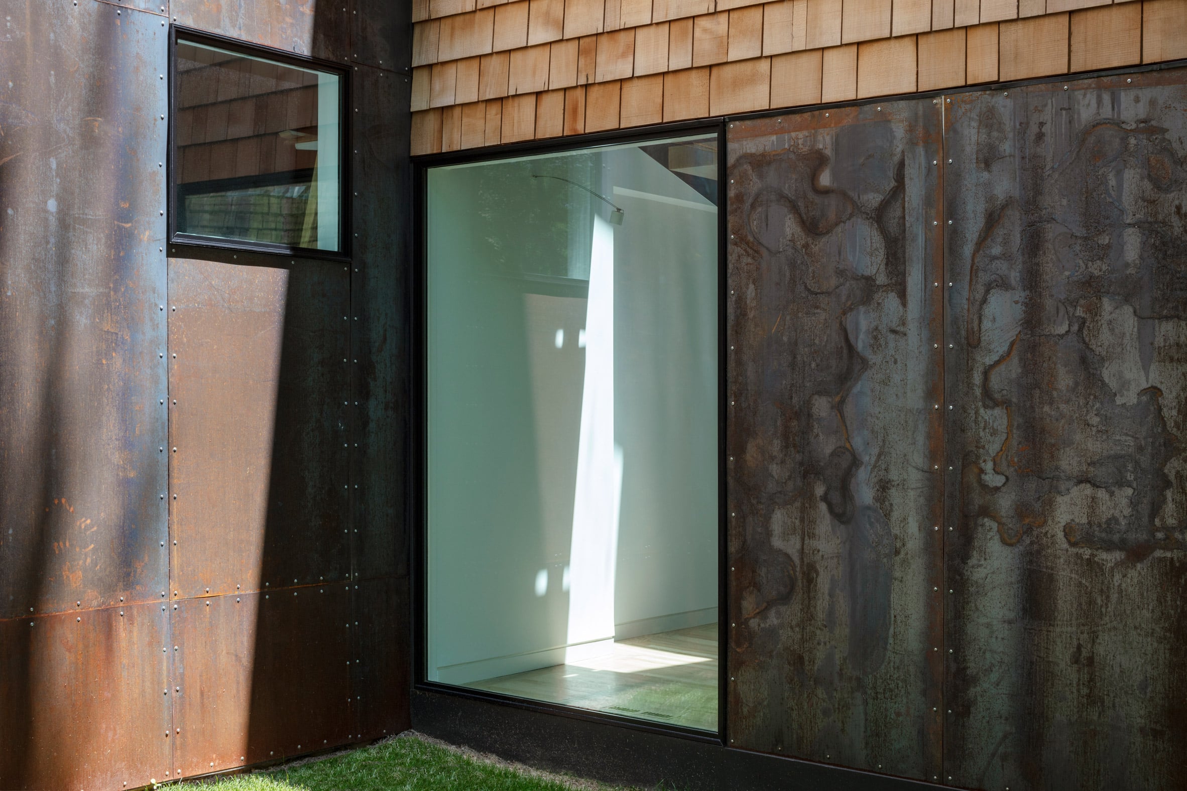 Window with cedar shake and steel details