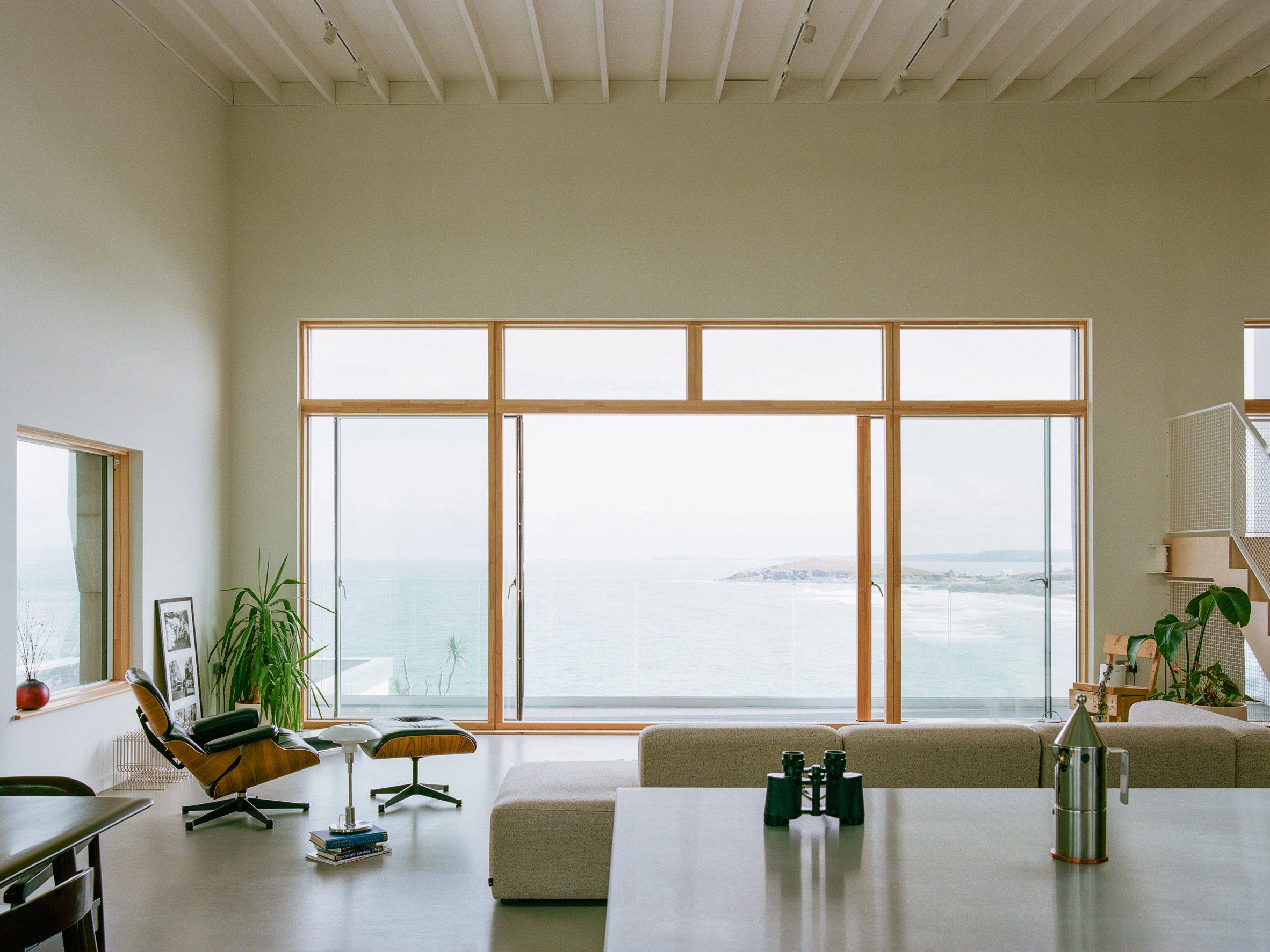 Minimalist living room inside House by the Sea by Of Architecture