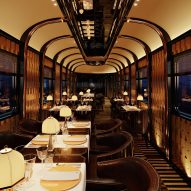 Interior view of the dining area, which has dimmed lighting, a mirrored ceiling and cosy seating