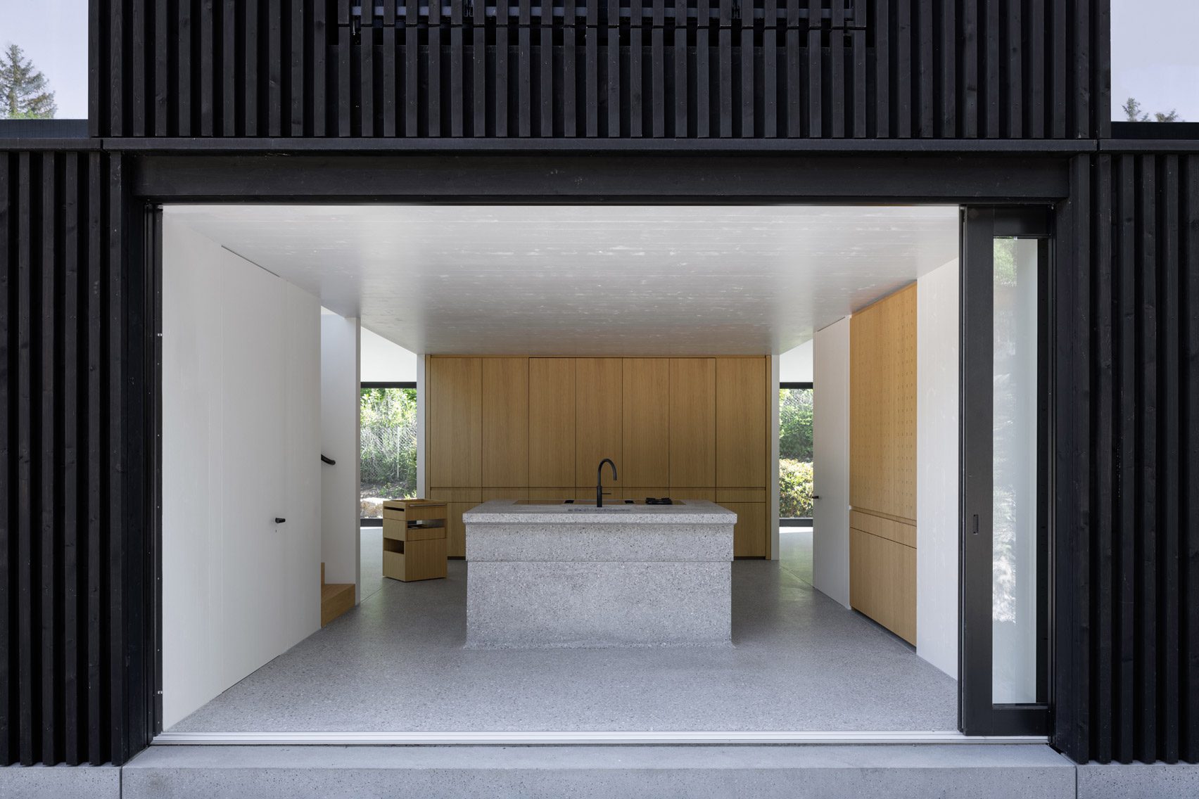 Kitchen with sliding glass wall