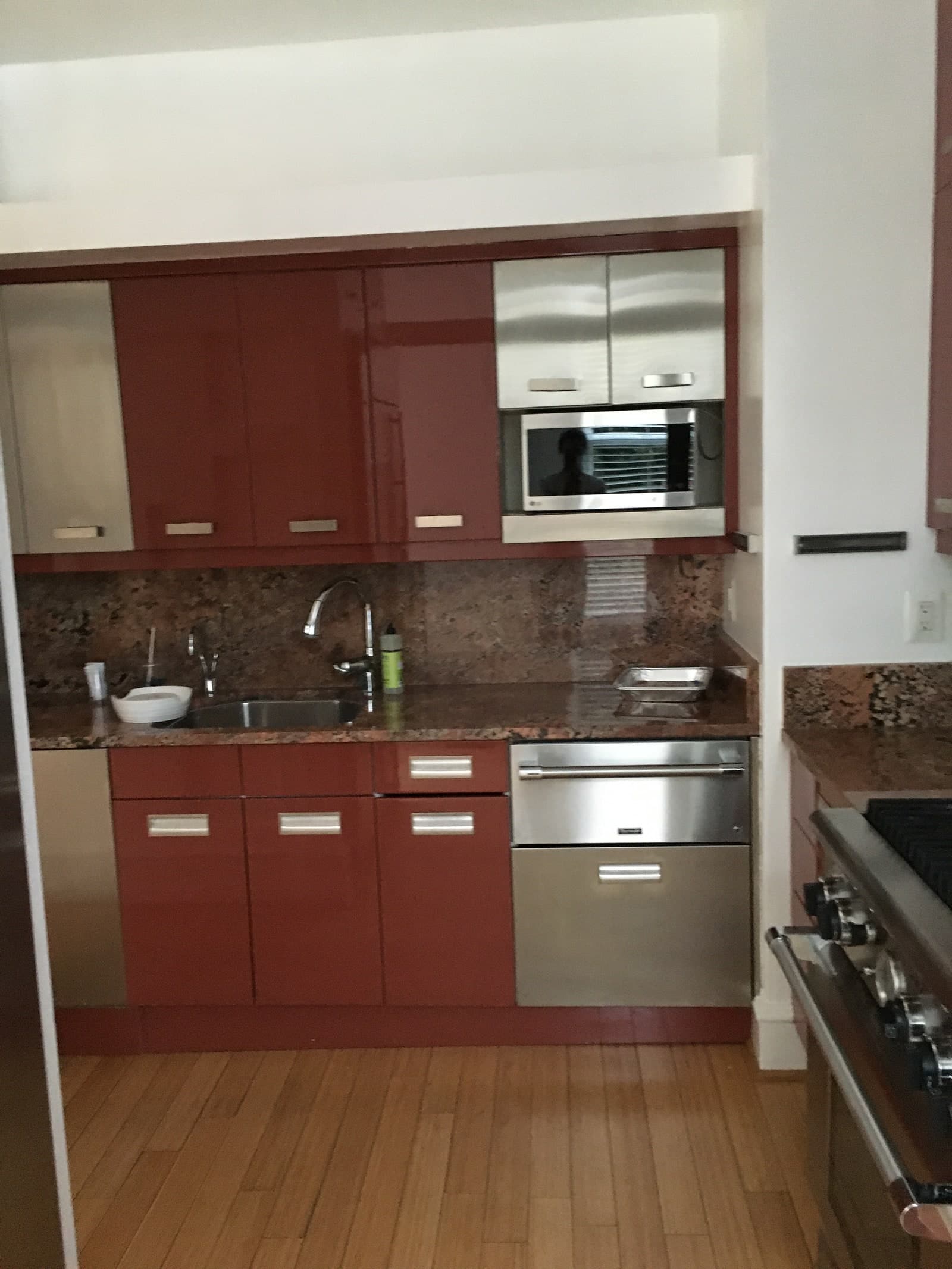 BEFORE The large gap between the upper cabinetry and the ceiling made the room feel short and squat.