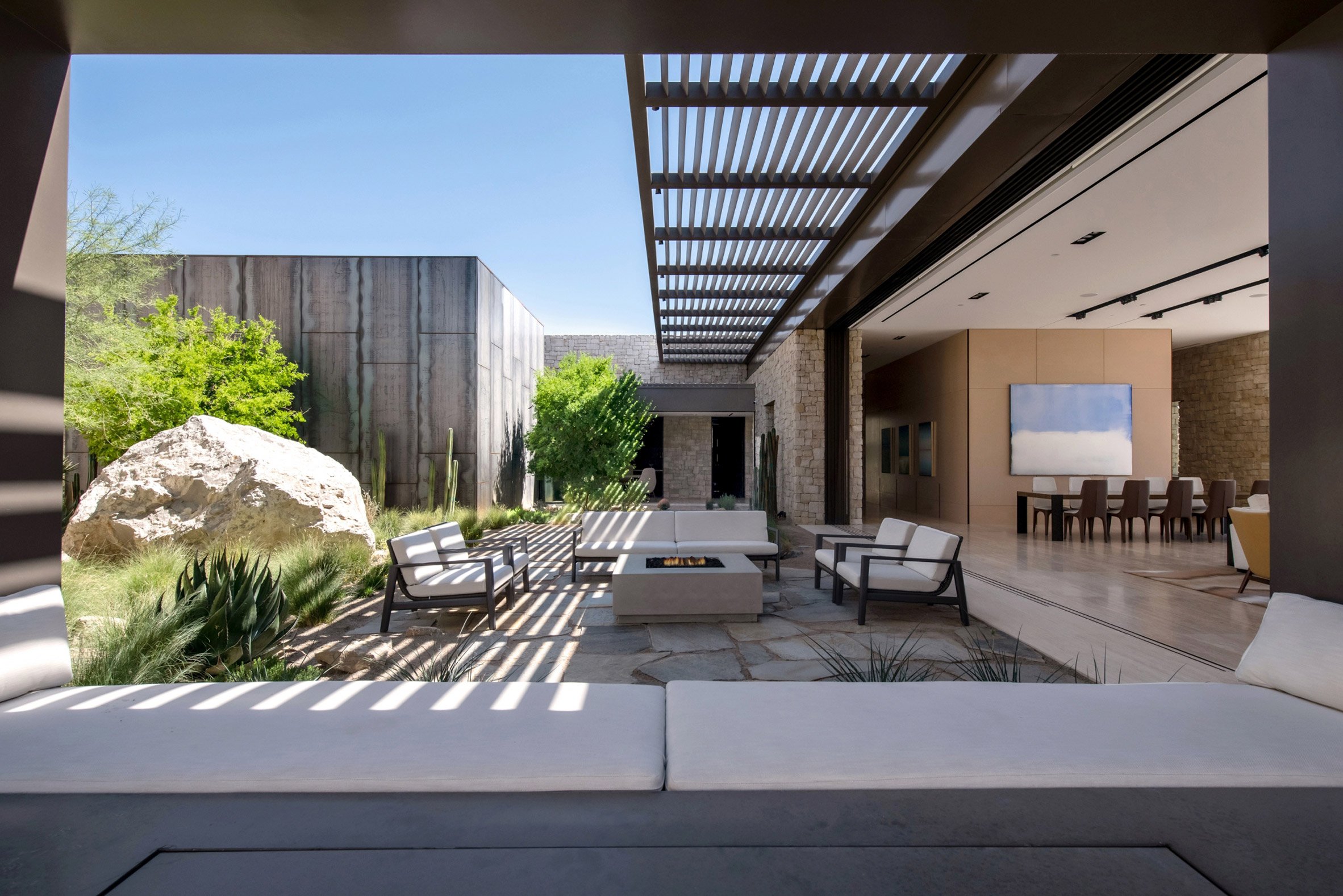 Shaded courtyard with an excavated boulder