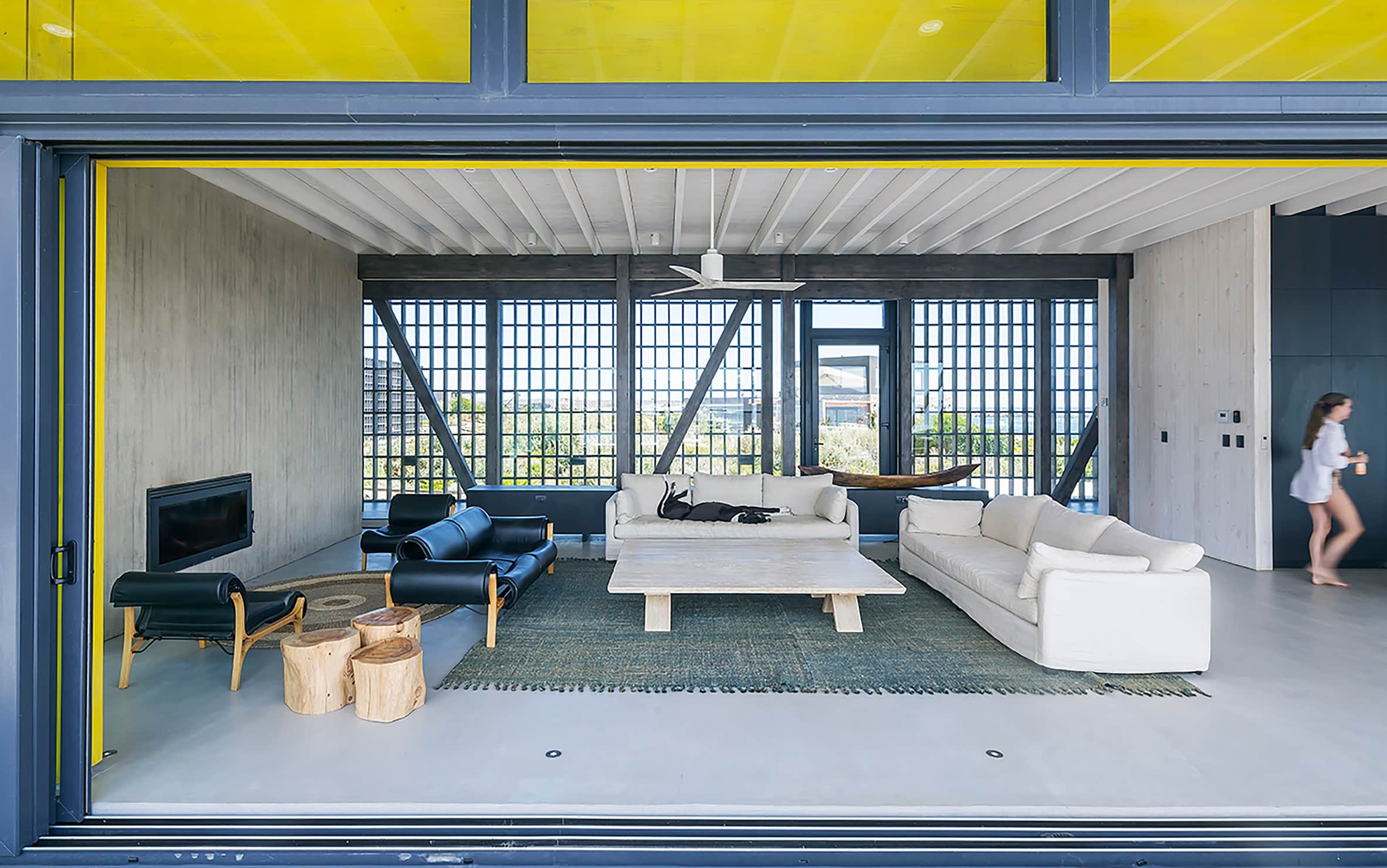 Living area with couches and concrete walls