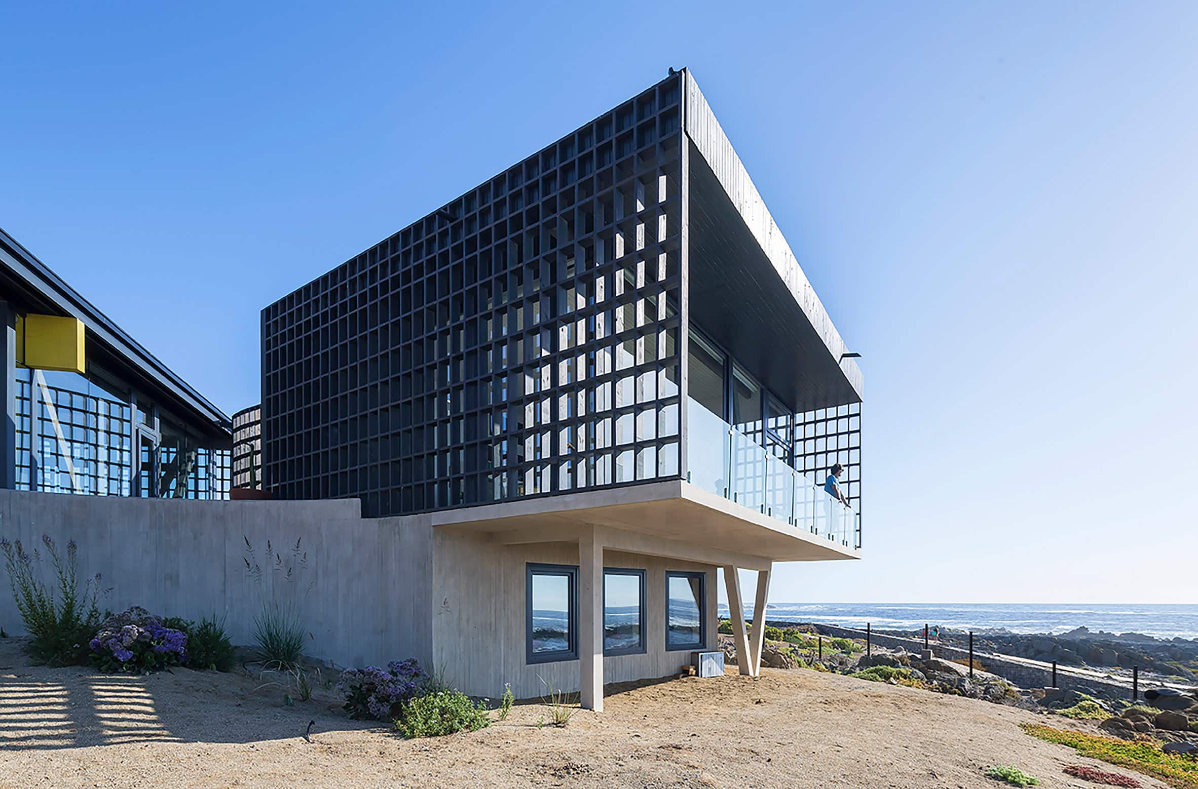 Sea-facing volume on stilts