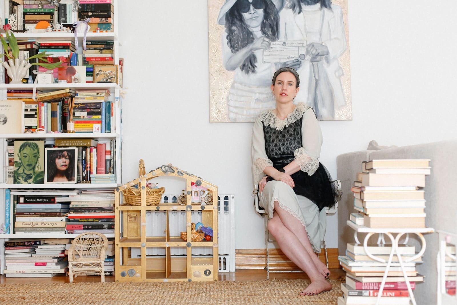 Catbirds chief creative officer Leigh Plessner sitting in the swan chair beneath a Yoko Ono and John Lennon painting—a...