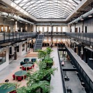 Interior atrium space with large skylight and open-plan co-working space