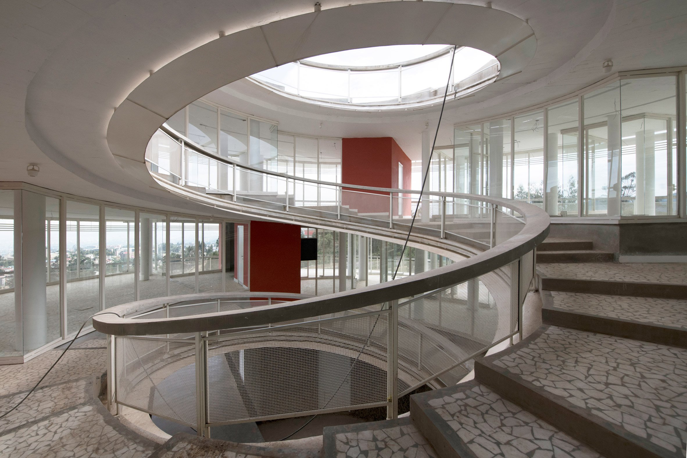 Internal spiral staircase with a circular opening in the roof