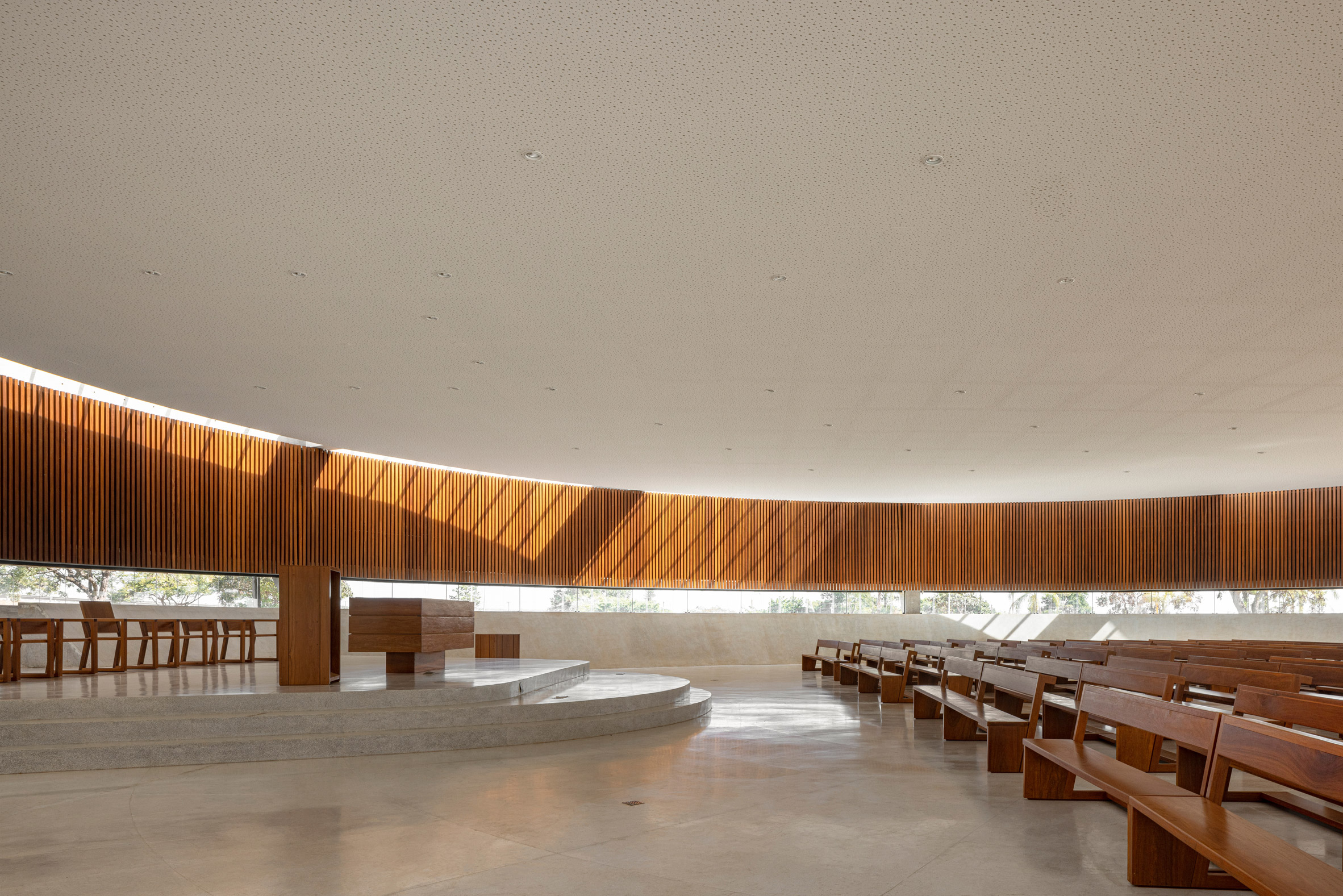 Interior of church with wooden pews and slats