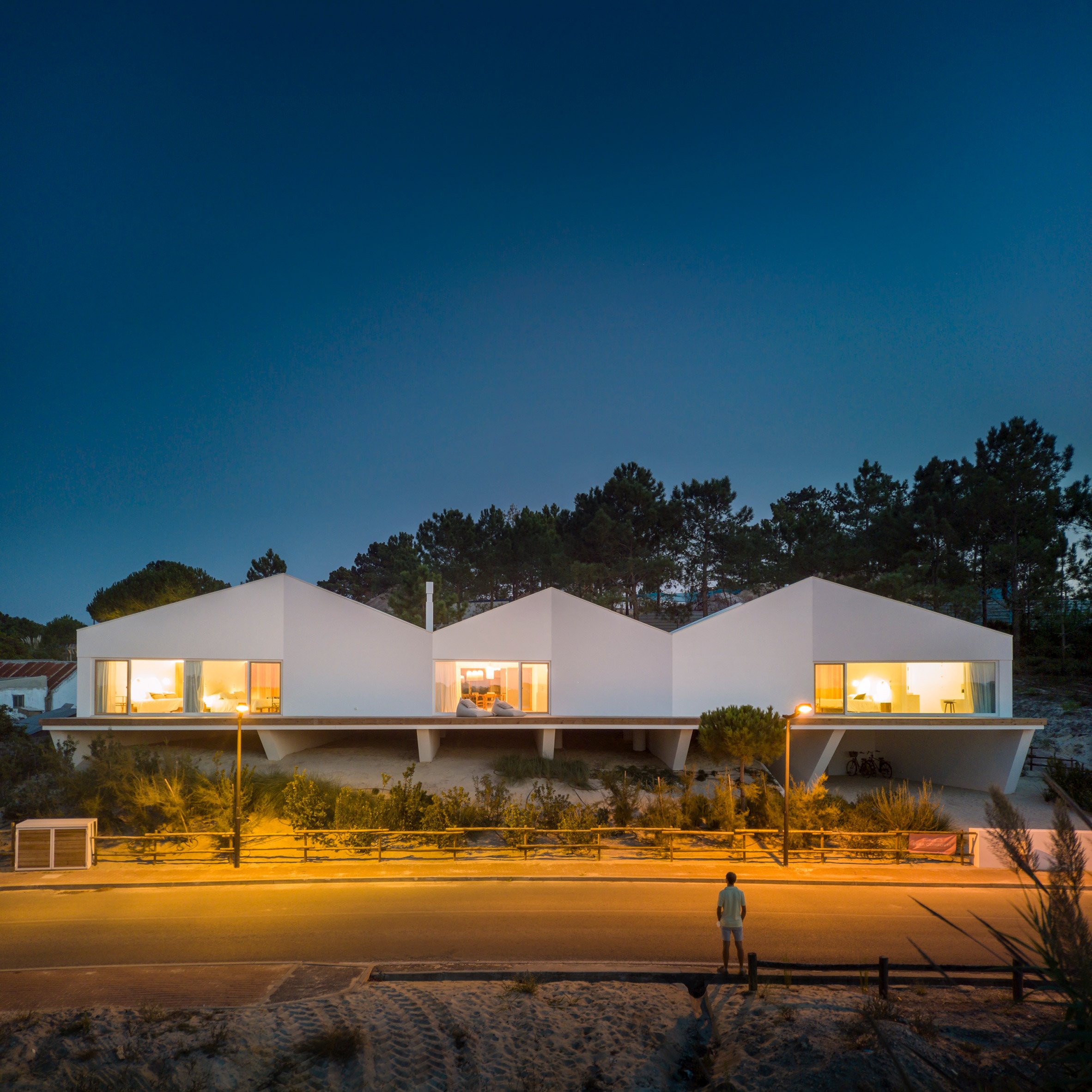 Night view of Pura Comporta vacation villa by Falcão de Campos