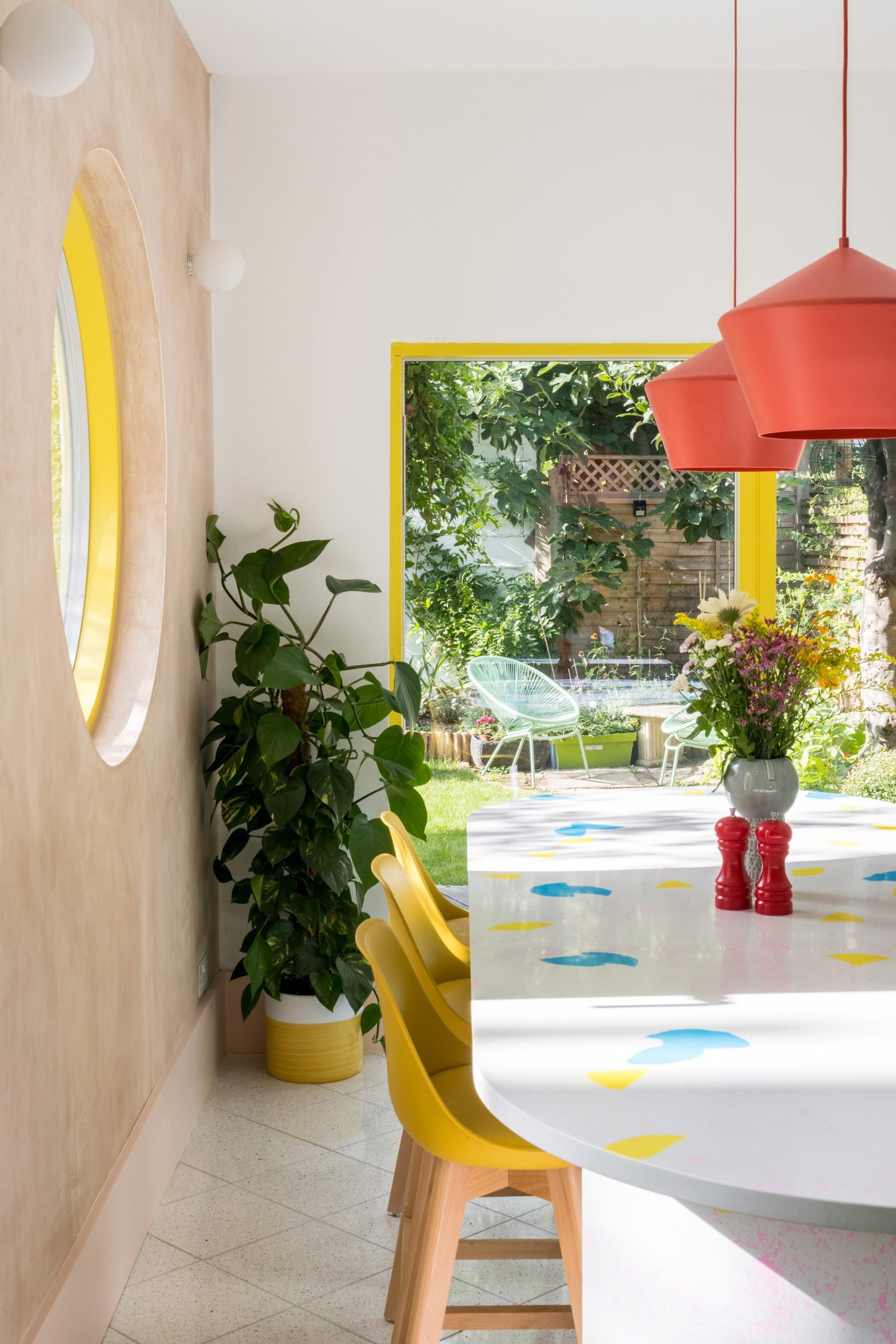 Colourful kitchen with ivy plant and island