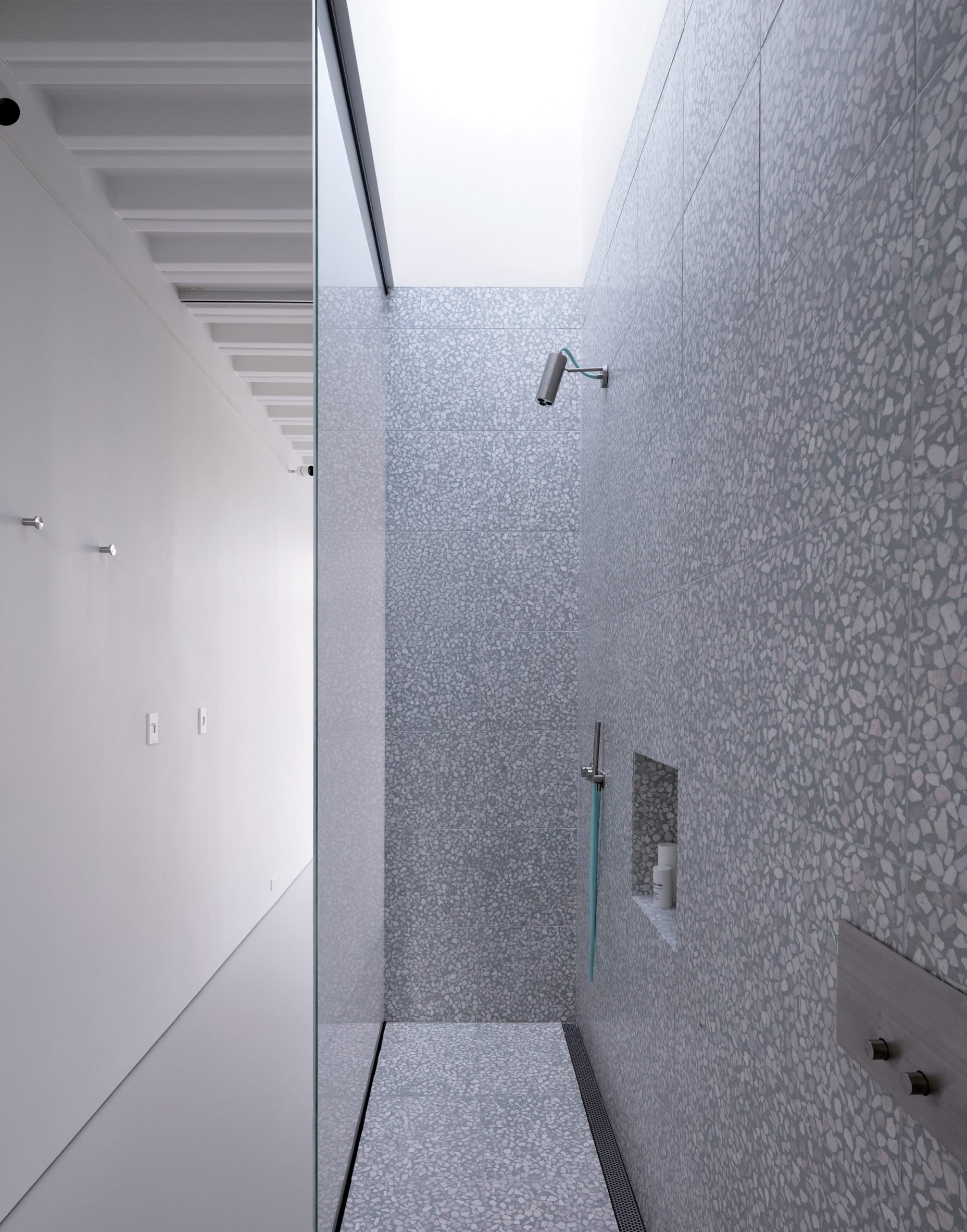 Grey bathroom at Narrow House by Only If