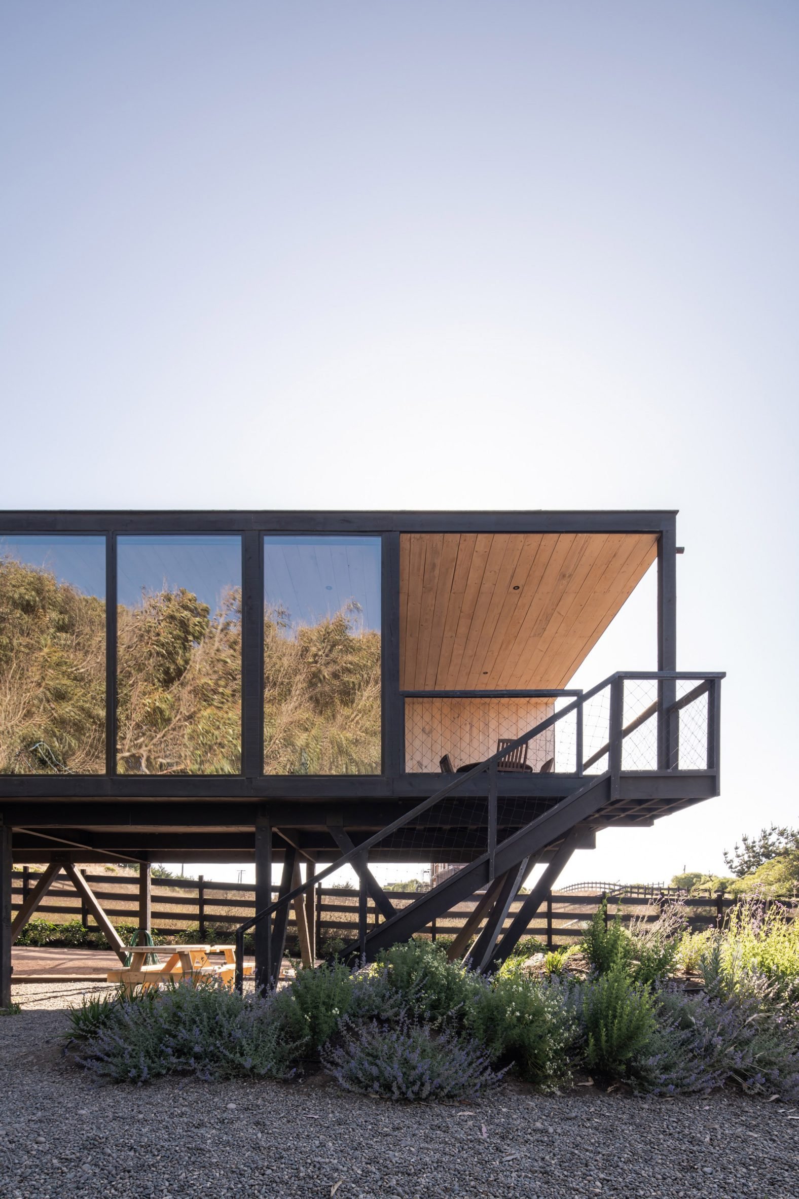 Home on stilts with glass windows