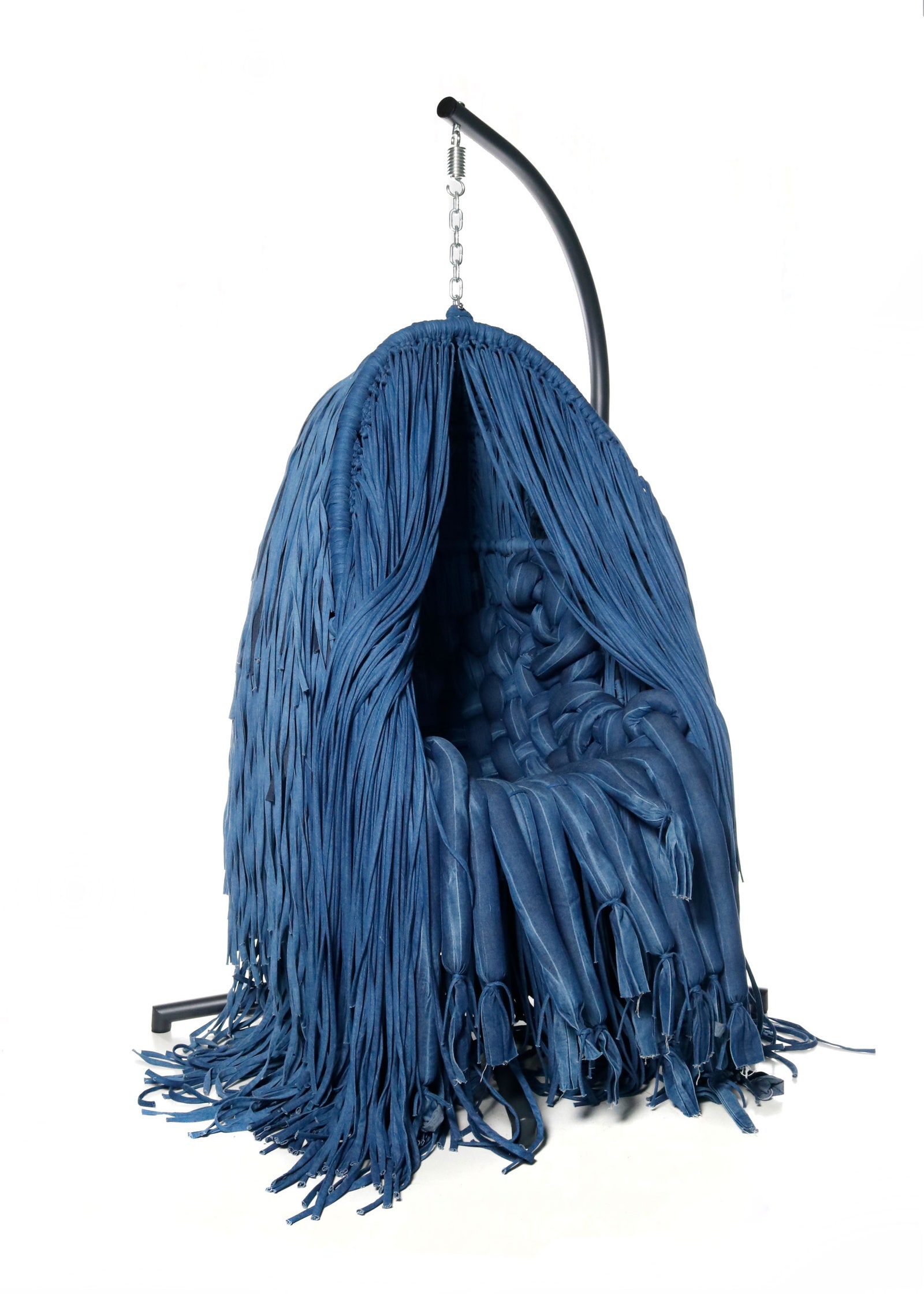 A hanging chair made out of repurposed denim by 69.