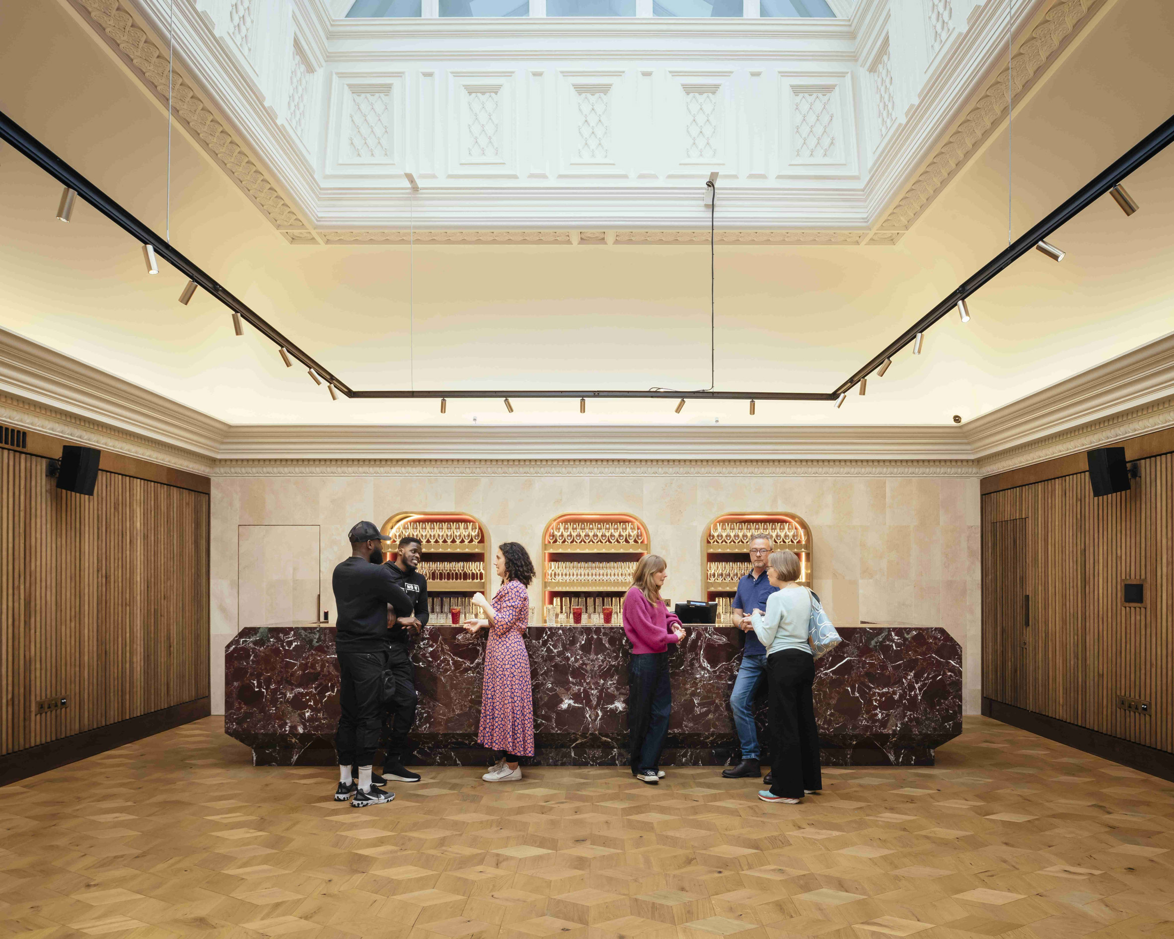 Red marble bar by Benedetti Architects