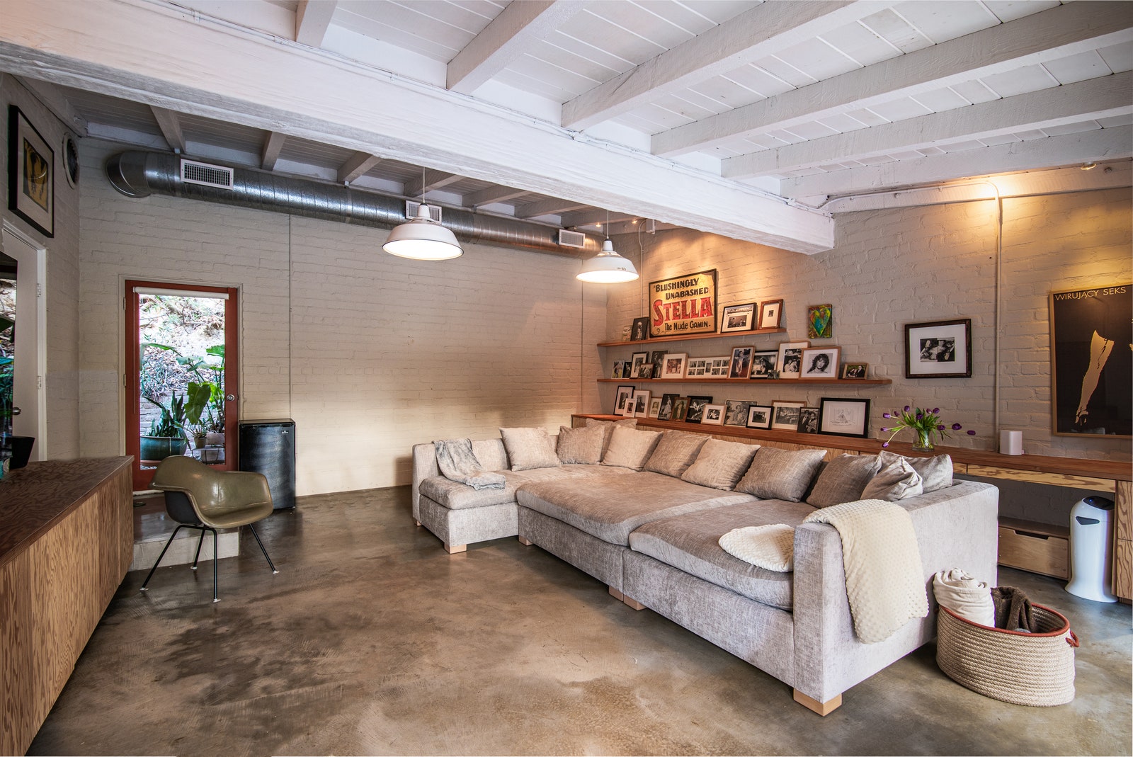 BEFORE Painting the exposed duct in the family room gave the room a classy update that matched the updated layout color...