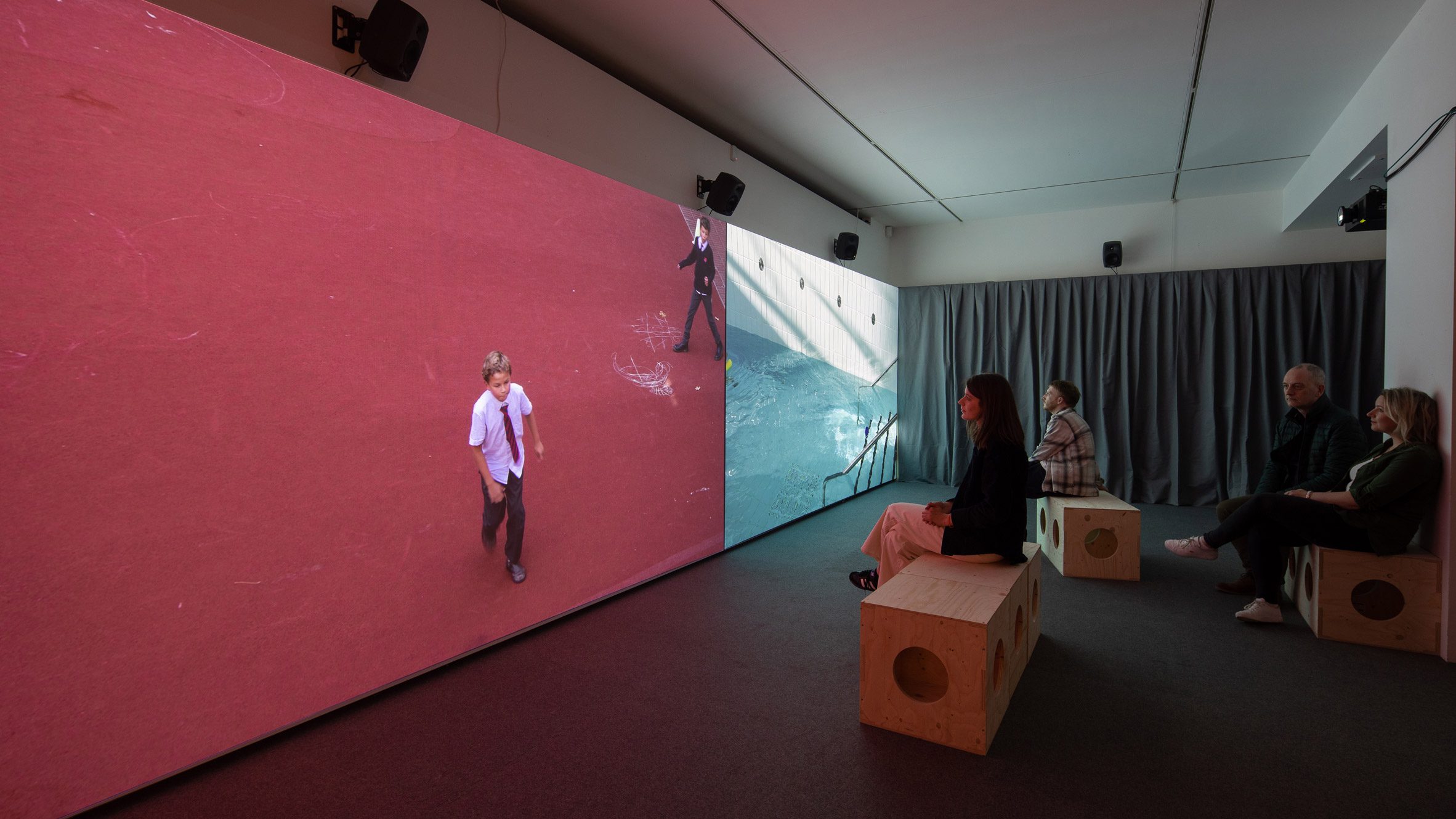 Dual screen showing film at RIBA