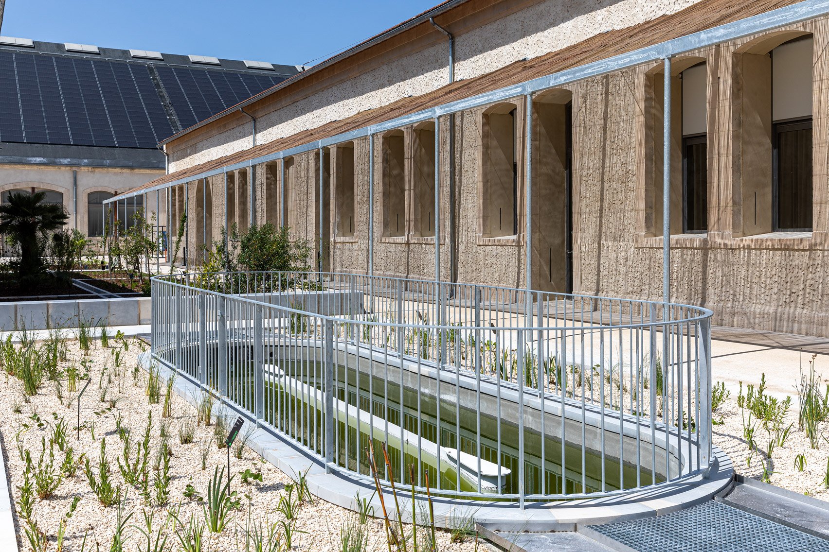 Courtyard outside of Le Magasin Électrique by Atelier Luma, Assemble and BC Architects & Studies
