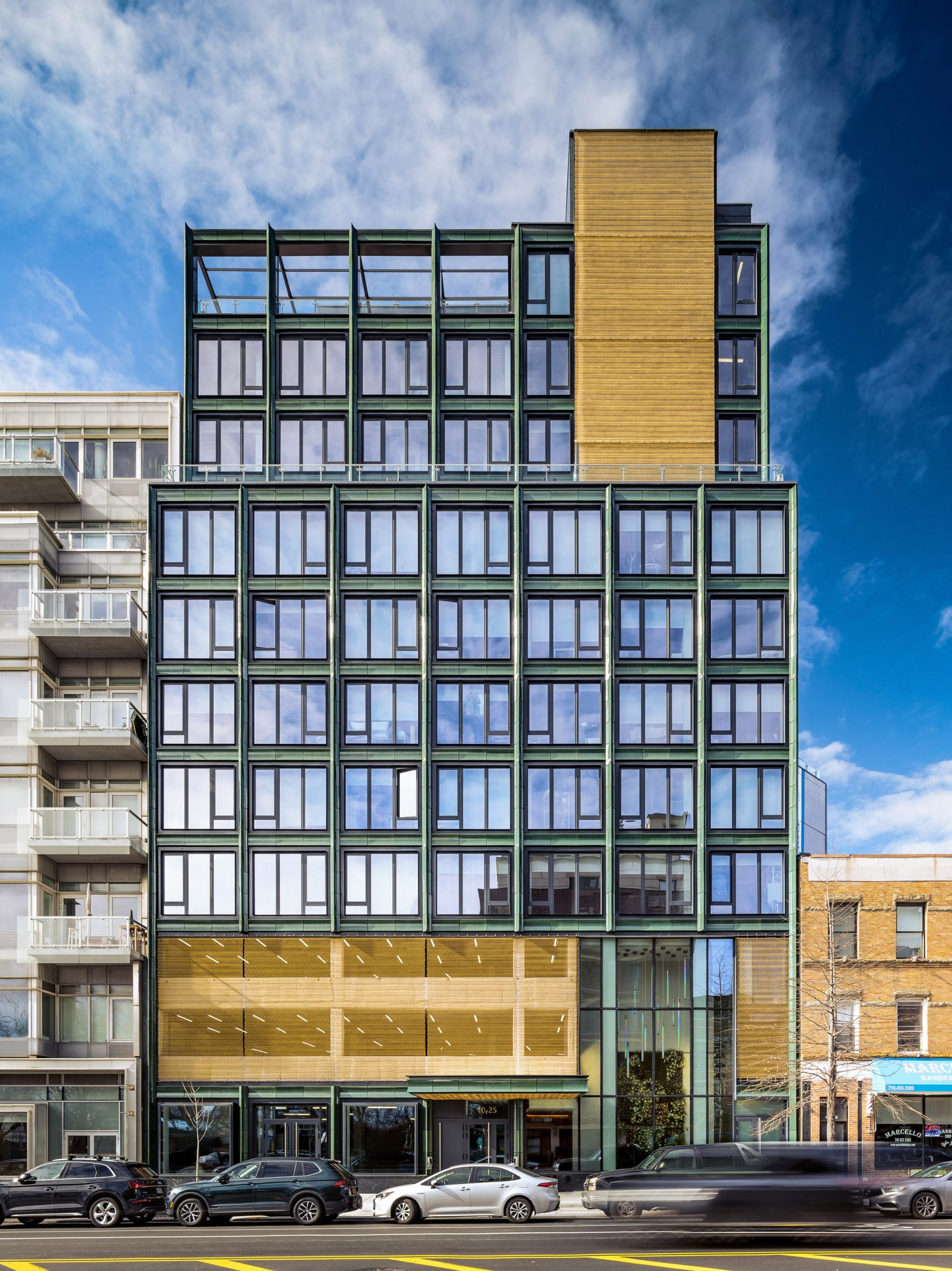 Terracotta-clad street-facing facade of The Green House by Studio V