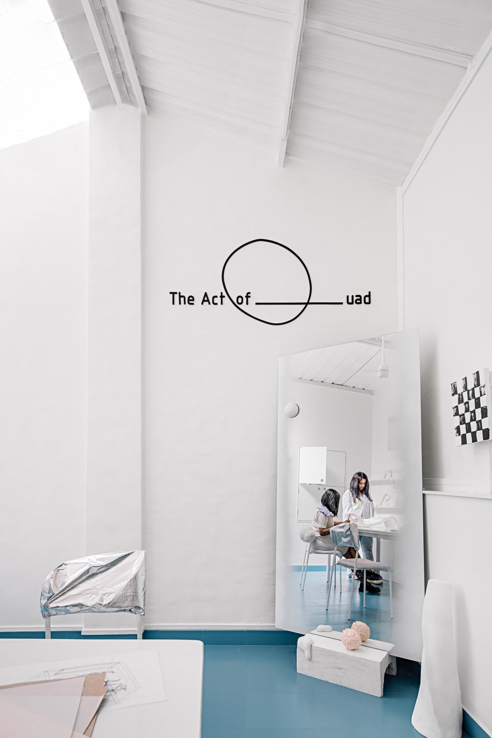 The Act of Quad studio with Priyanka Itadkar and Falguni Bhatia reflected in a mirror