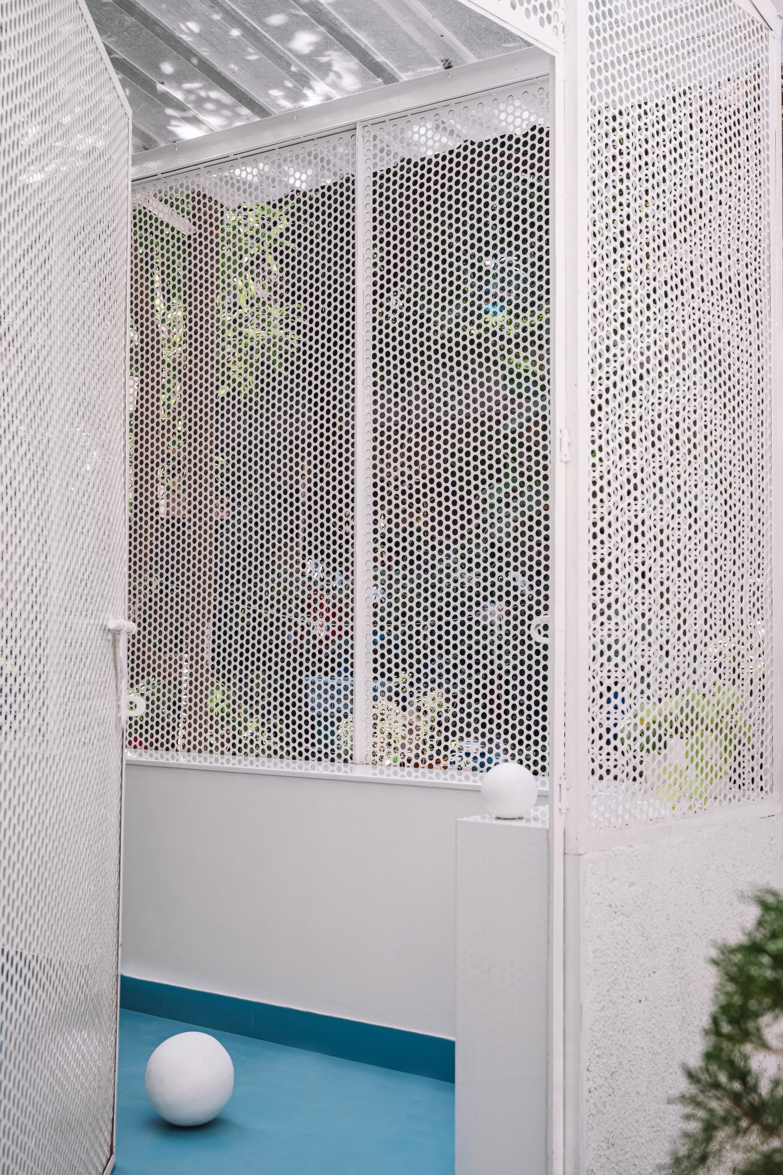 Perforated metal screen wall