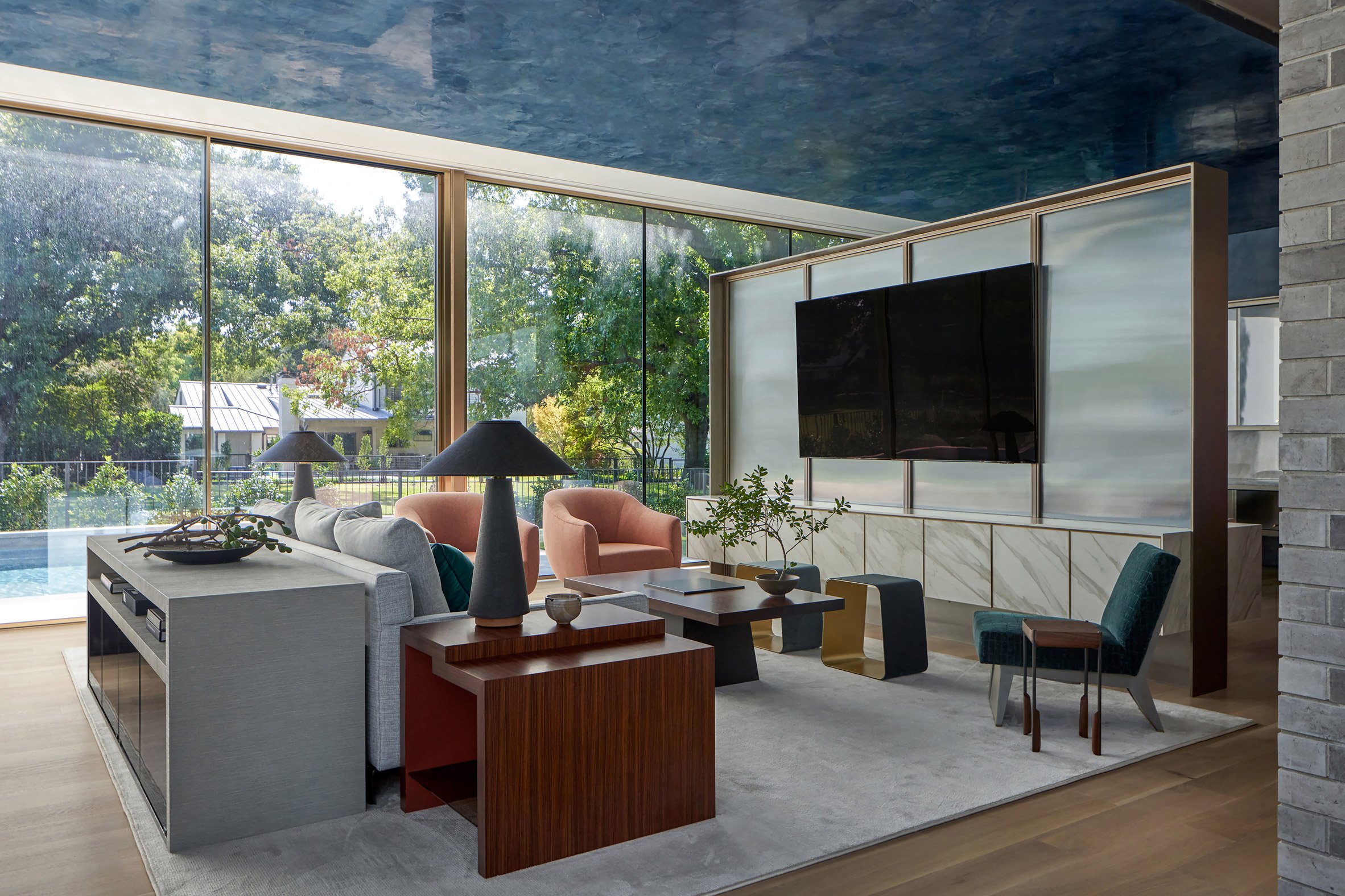 Floor-to-ceiling glazing and geometric furniture