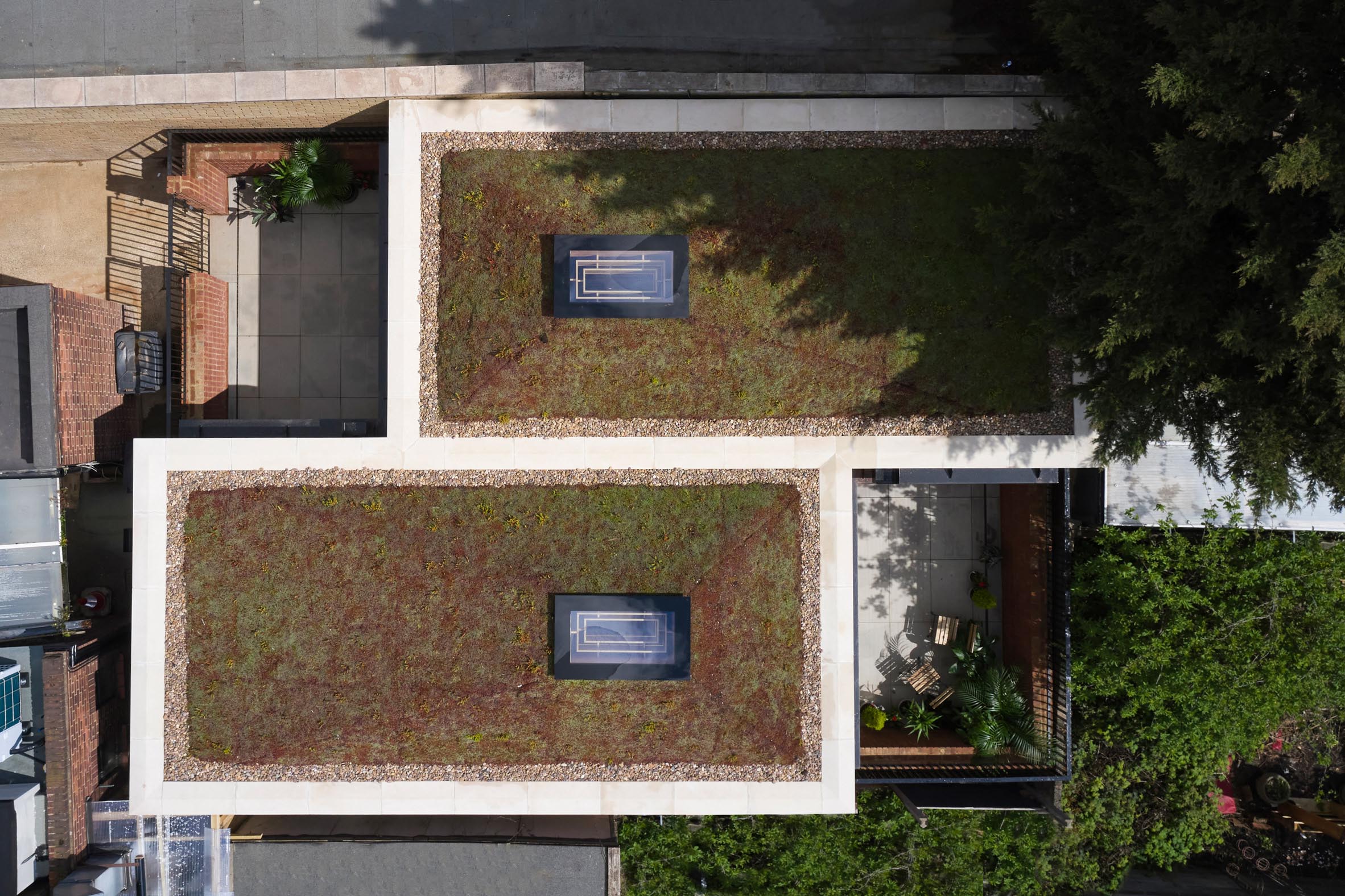Two pyramid shaped green roofs on Haringey Brick Bungalow