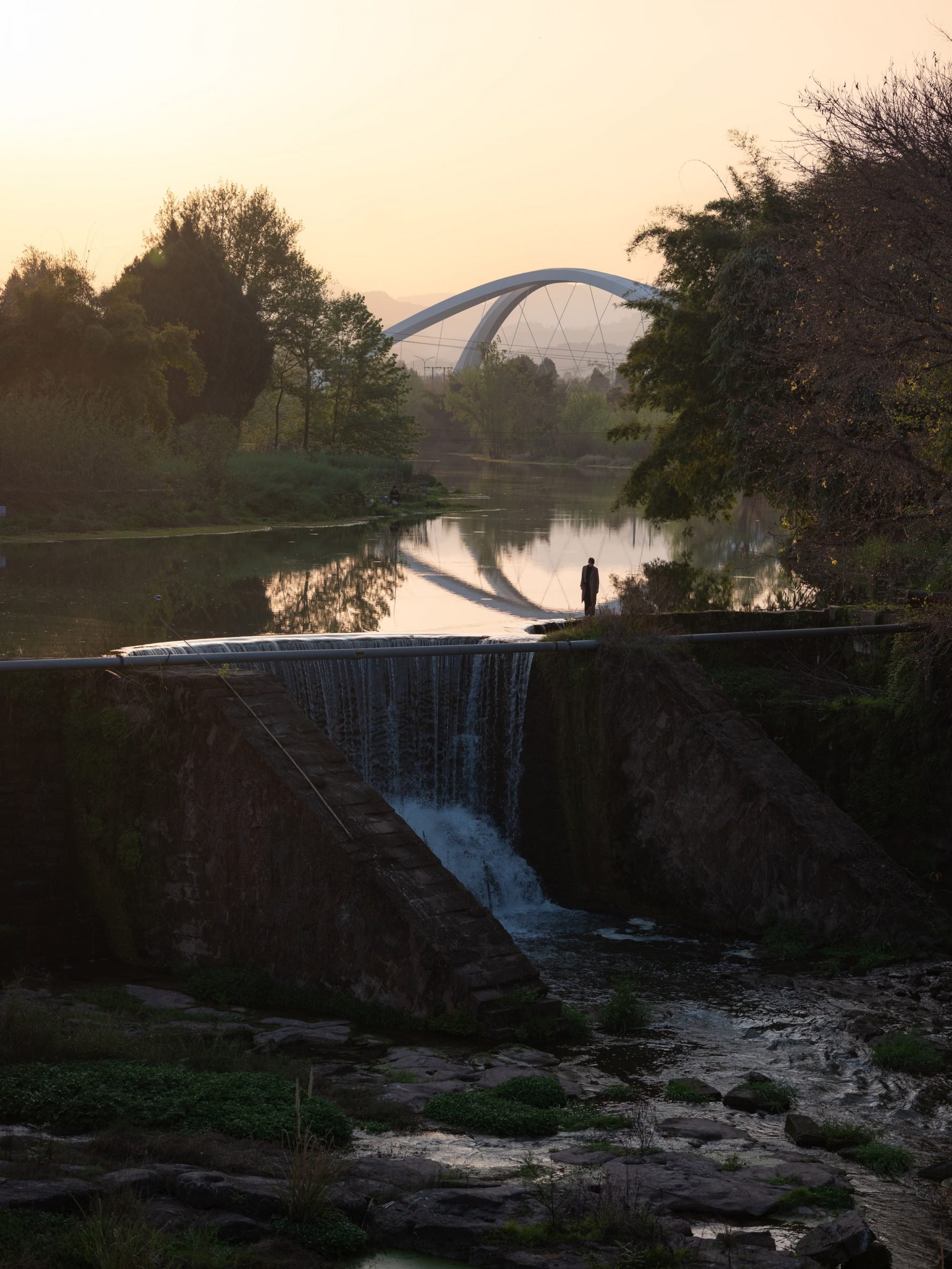 Person overlooking Jiangxi River Bridge by Zaha Hadid Architects
