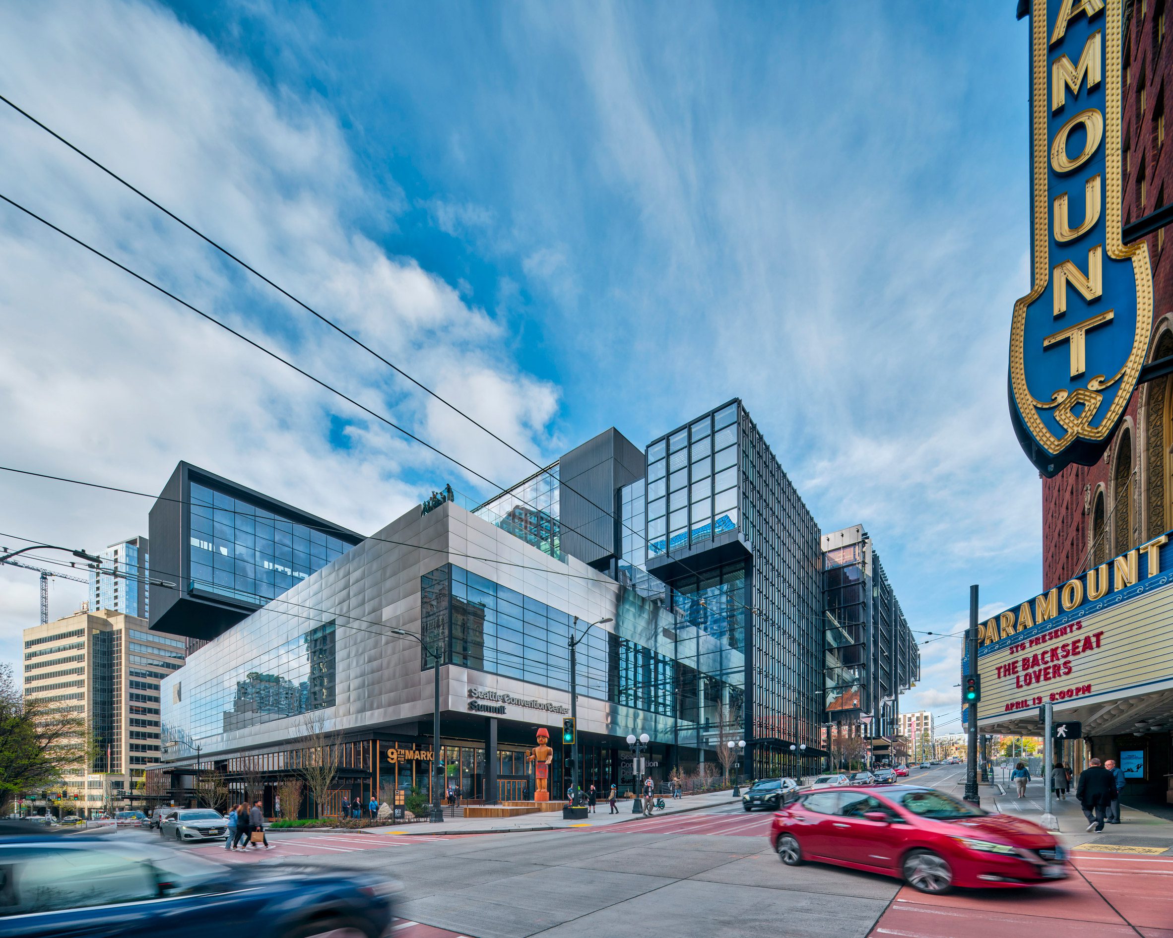 A building made of multiple glass and steel volumes
