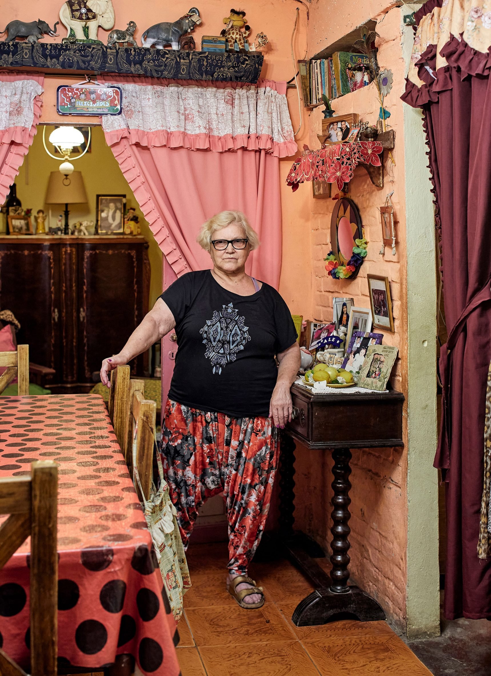 Resident inside her home in Villa 31 photography by Cristóbal Palma