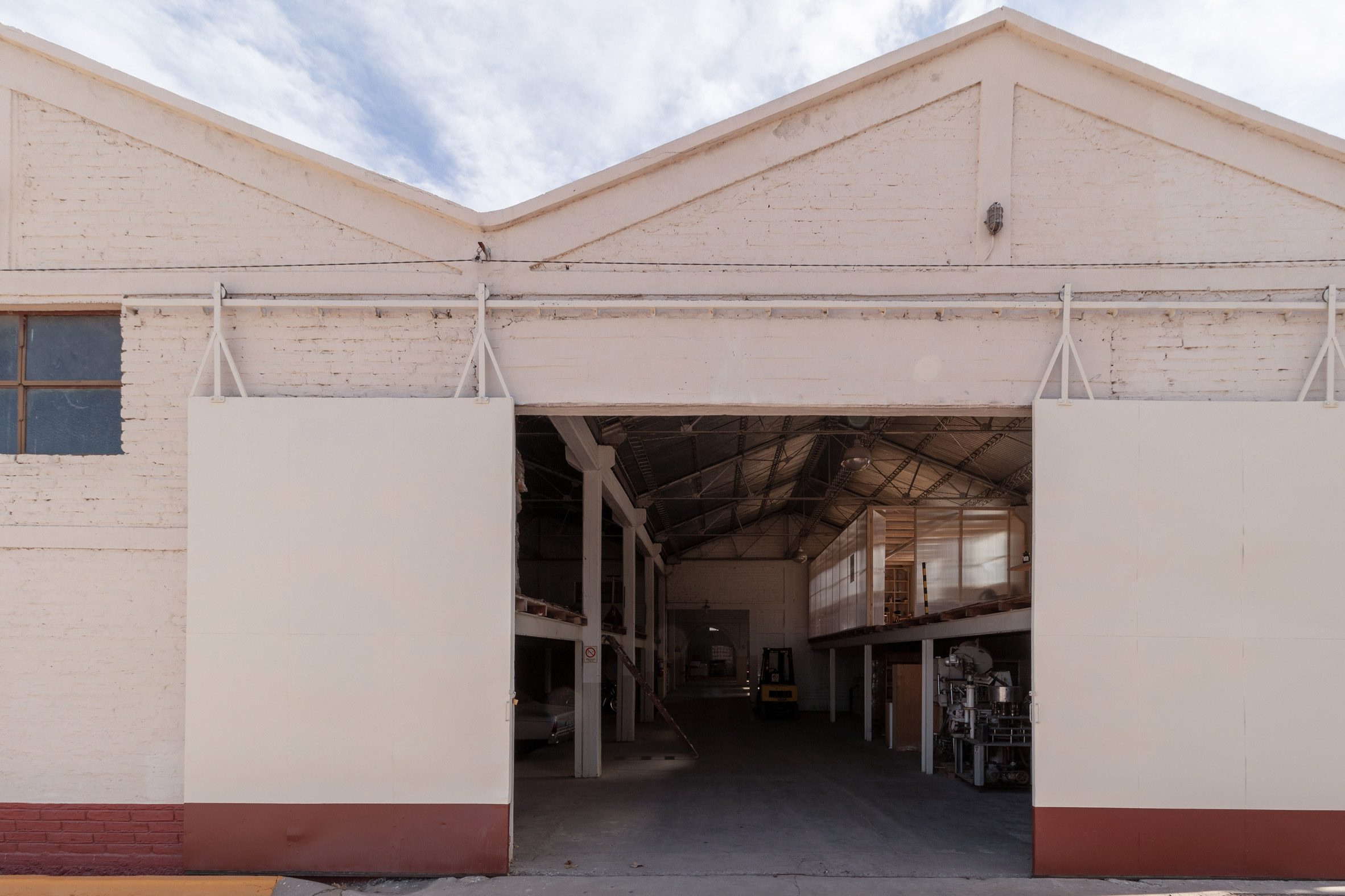 White warehouse with doors open