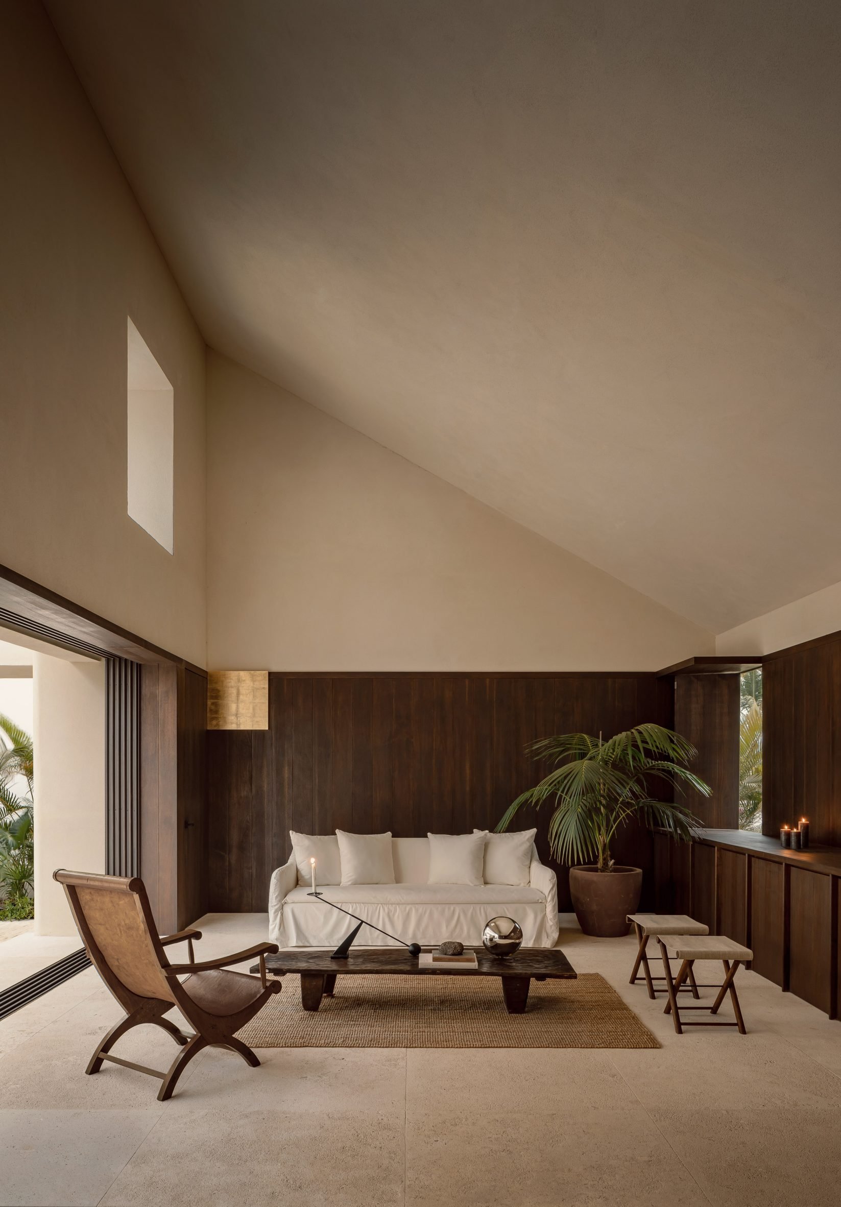 Living room with tall sloped ceiling
