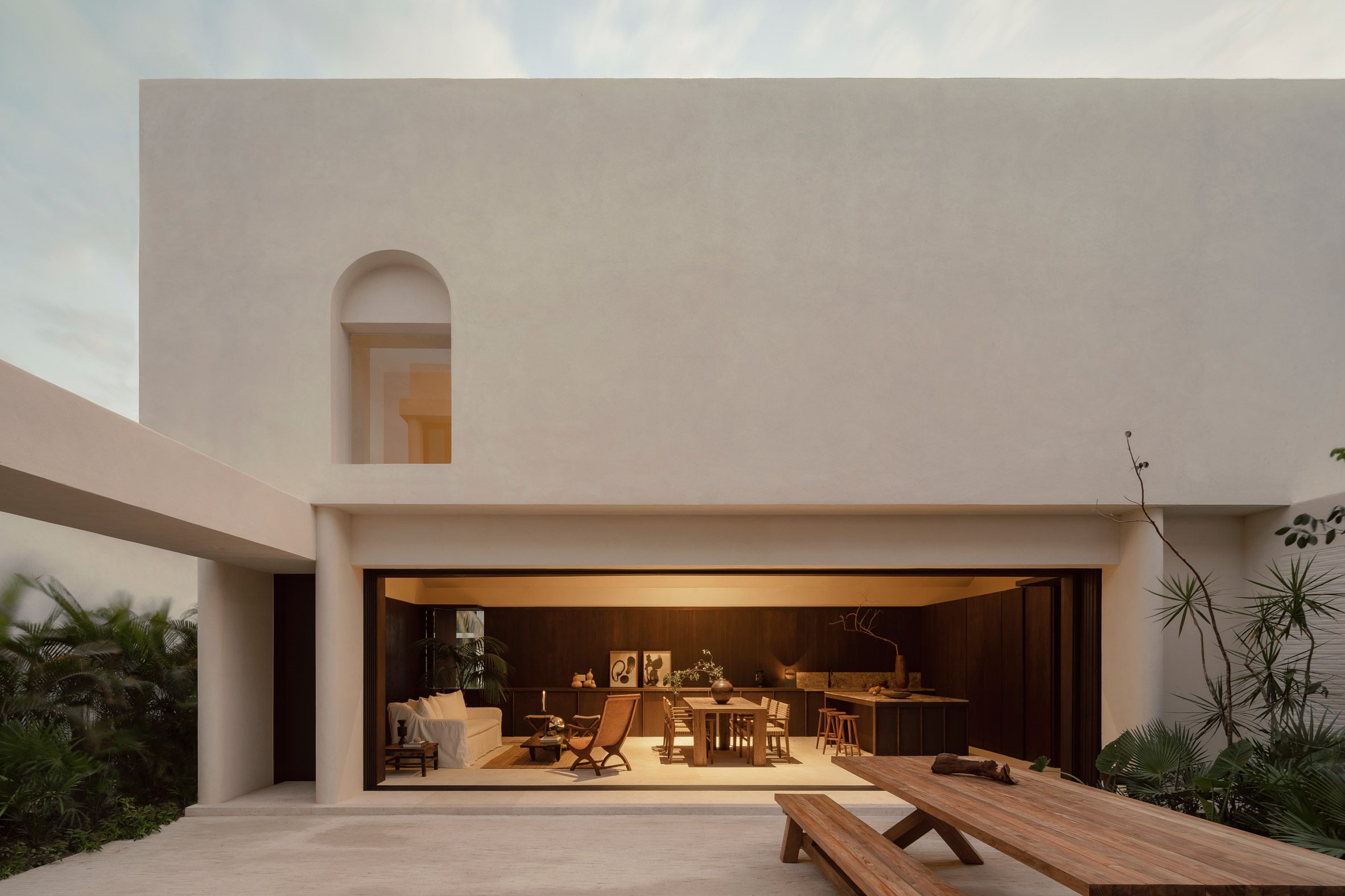 Minimalist house with ground floor that opens to a courtyard