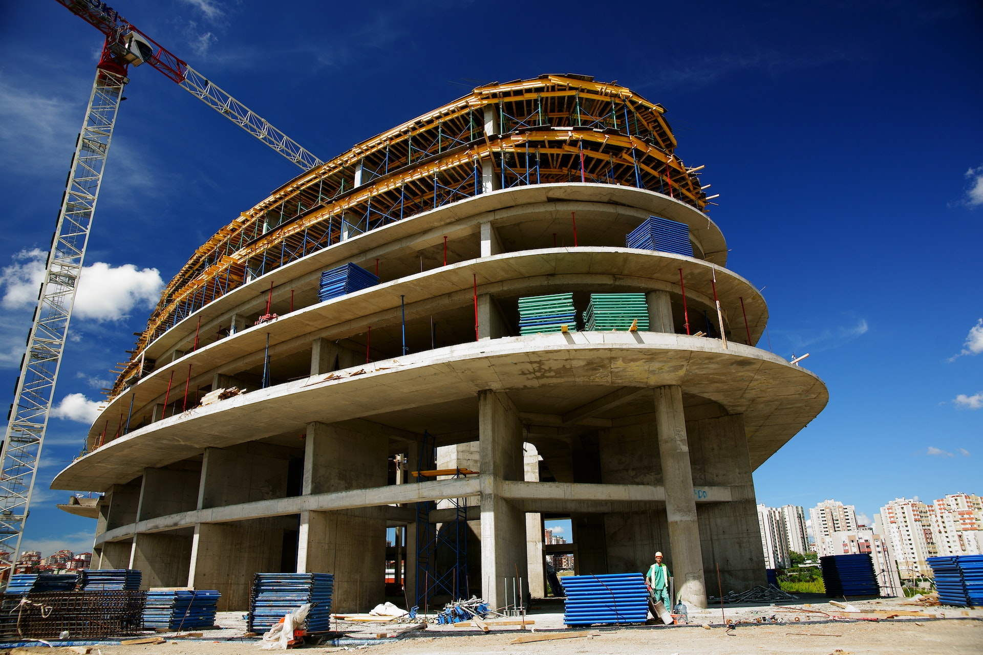 A construction site with workers using virtual reality technology to plan and develop the project