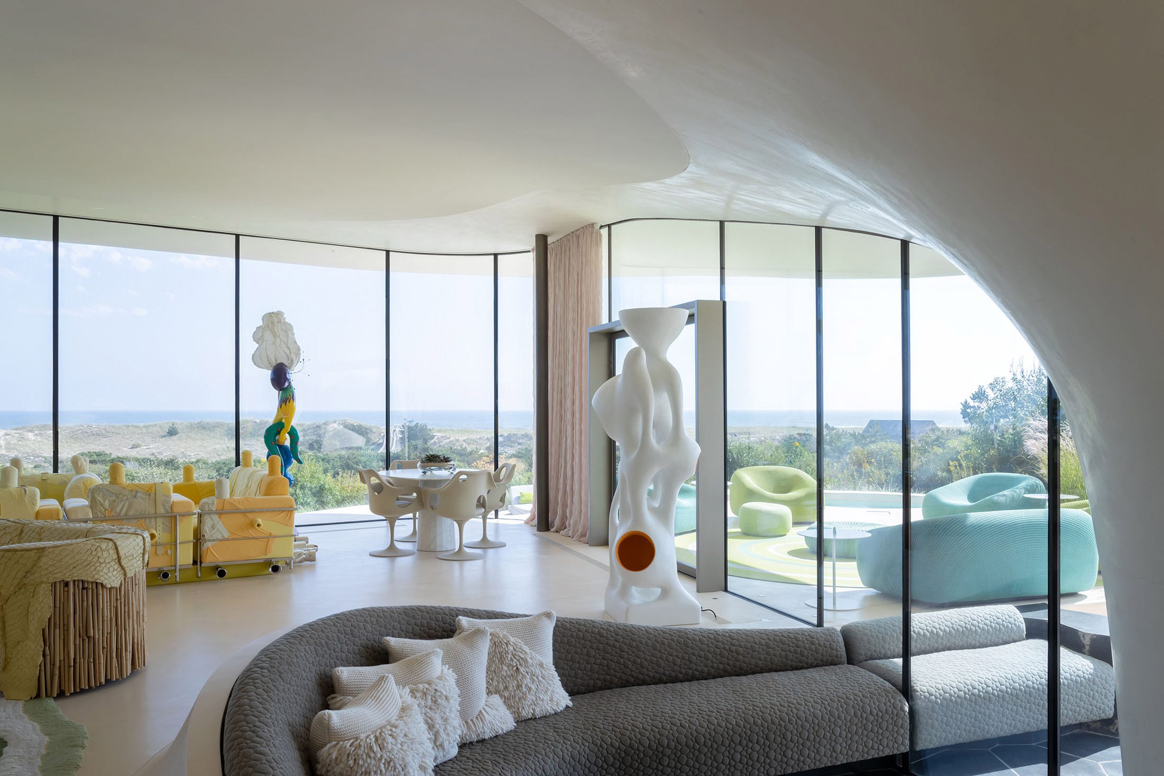 modern interior with sofas and sculptures