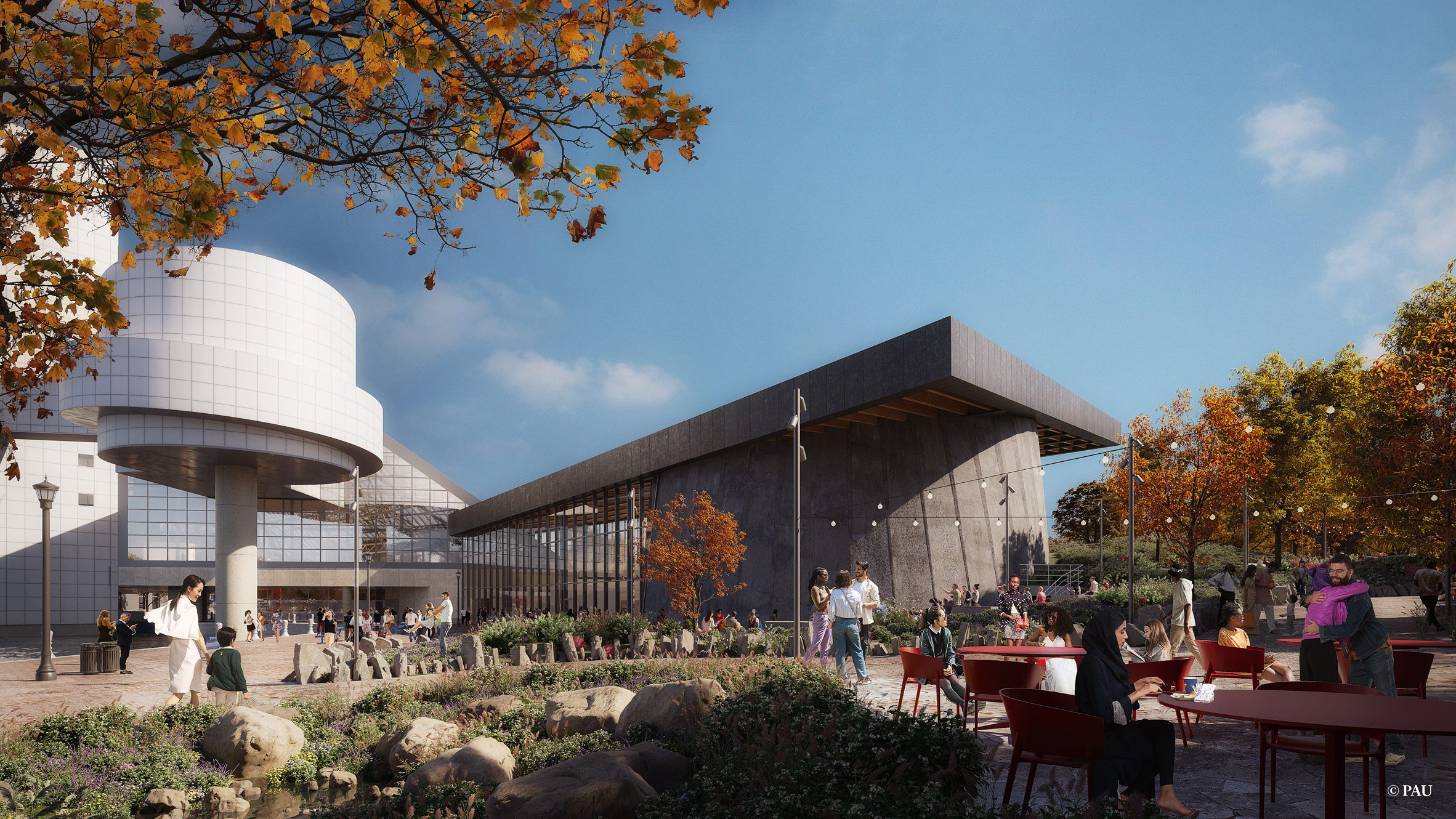 A black wedge shaped building interlocked with the white geometric building