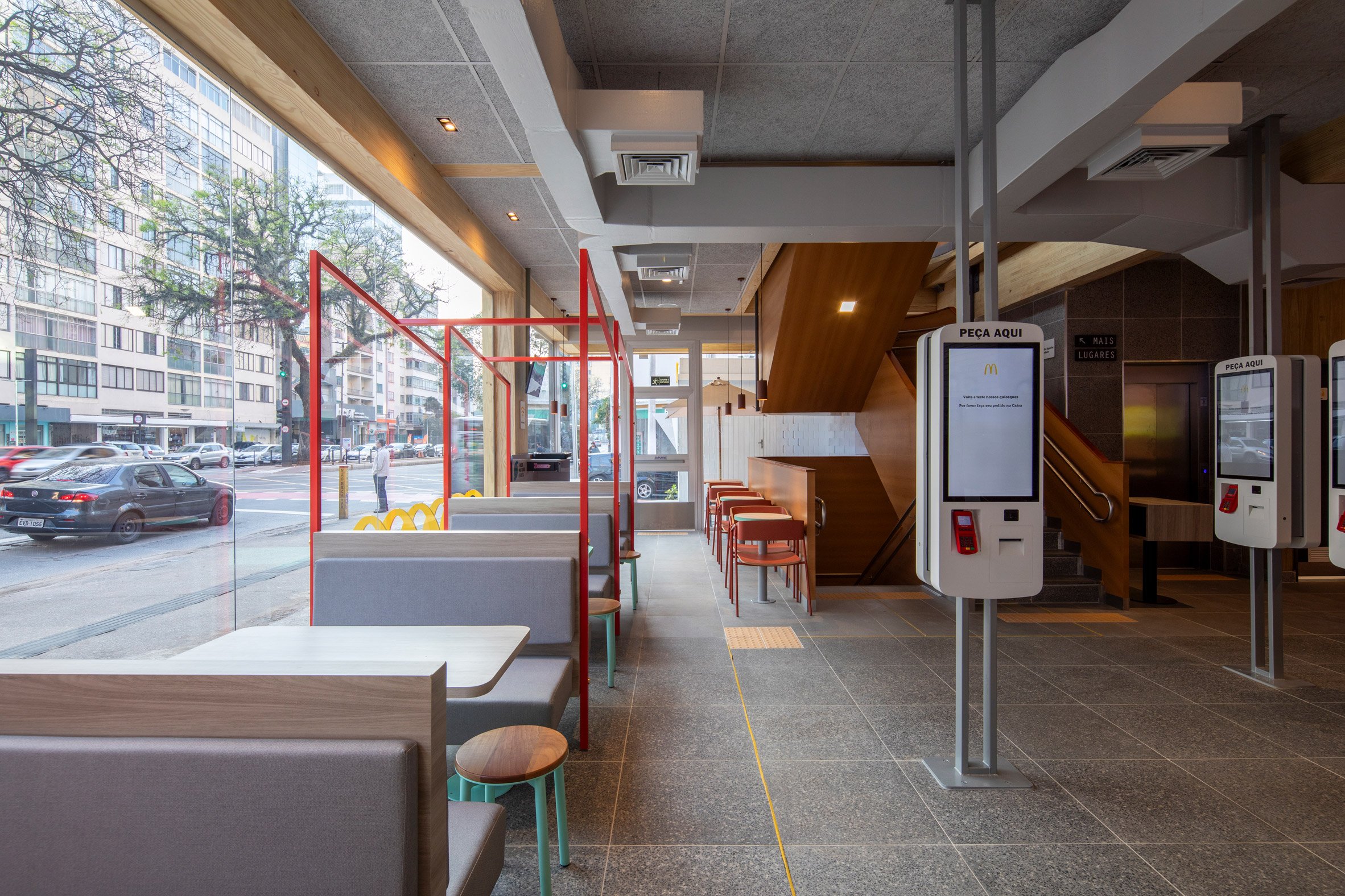 Interior seating at the mass timber McDonald's in Sao Paulo